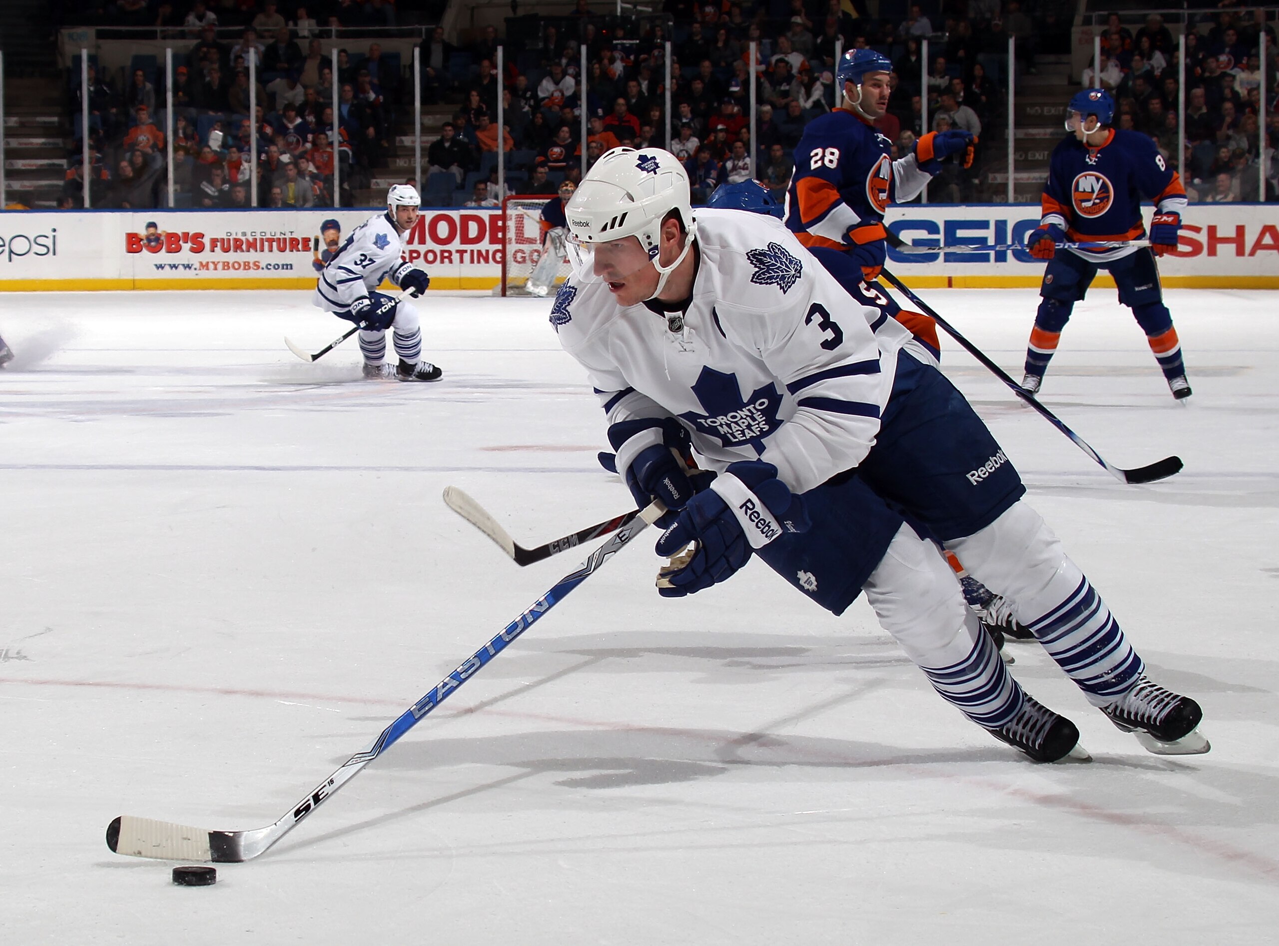 UNIONDALE, NY - MARCH 08:  Dion Phaneuf #3 of the Toronto Maple Leafs skates against the New York Islanders at the Nassau Coliseum on March 8, 2011 in Uniondale, New York. The Islanders defeated the Leafs 4-3 in overtime.  (Photo by Bruce Bennett/Getty Im