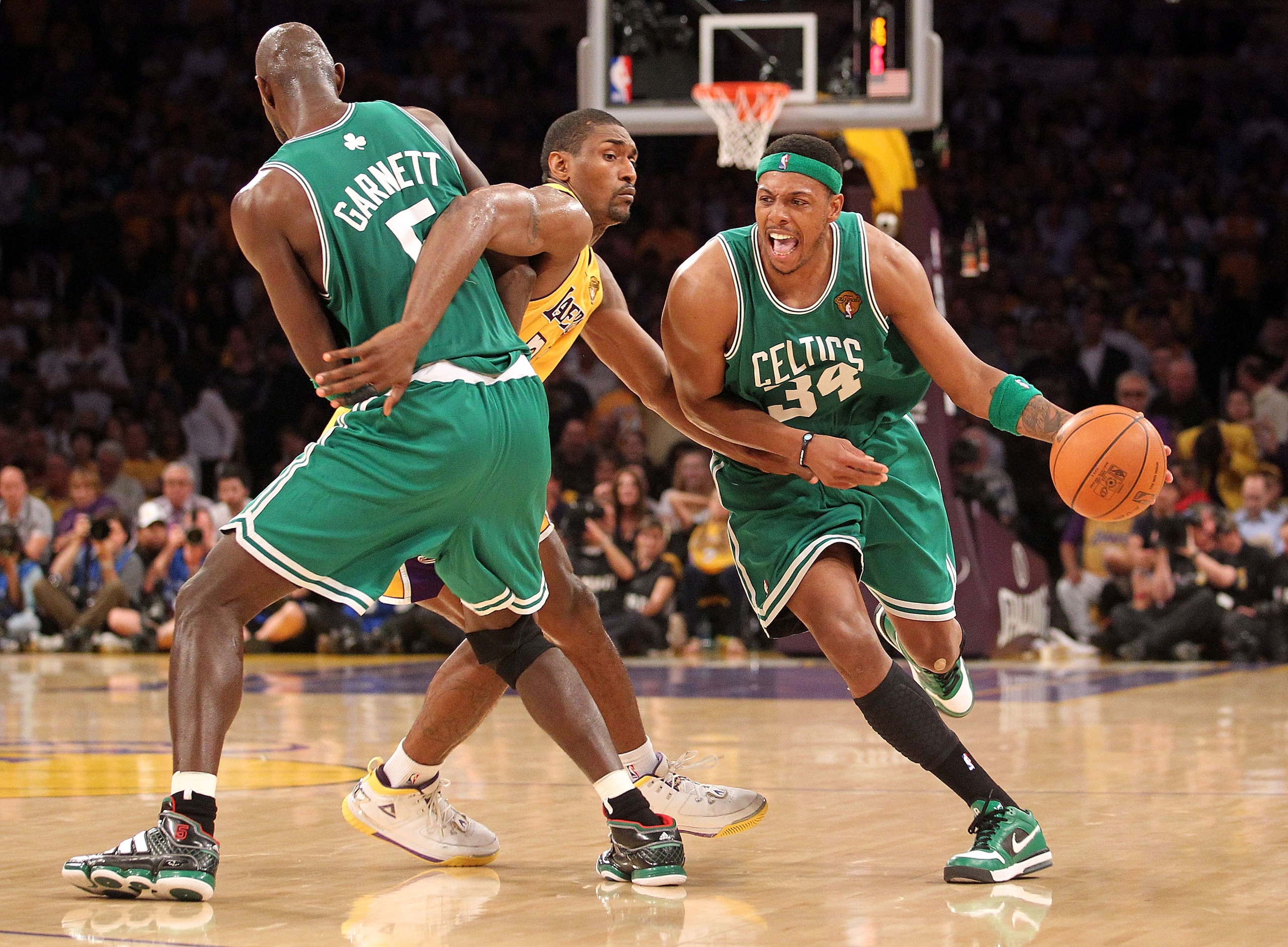 LOS ANGELES, CA - JUNE 17:  Ray Allen #20 of the Boston Celtics moves the ball as Ron Artest #37 of the Los Angeles Lakers is screened by Kevin Garnett #5 of the Celtics in the third quarter of Game Seven of the 2010 NBA Finals at Staples Center on June 1