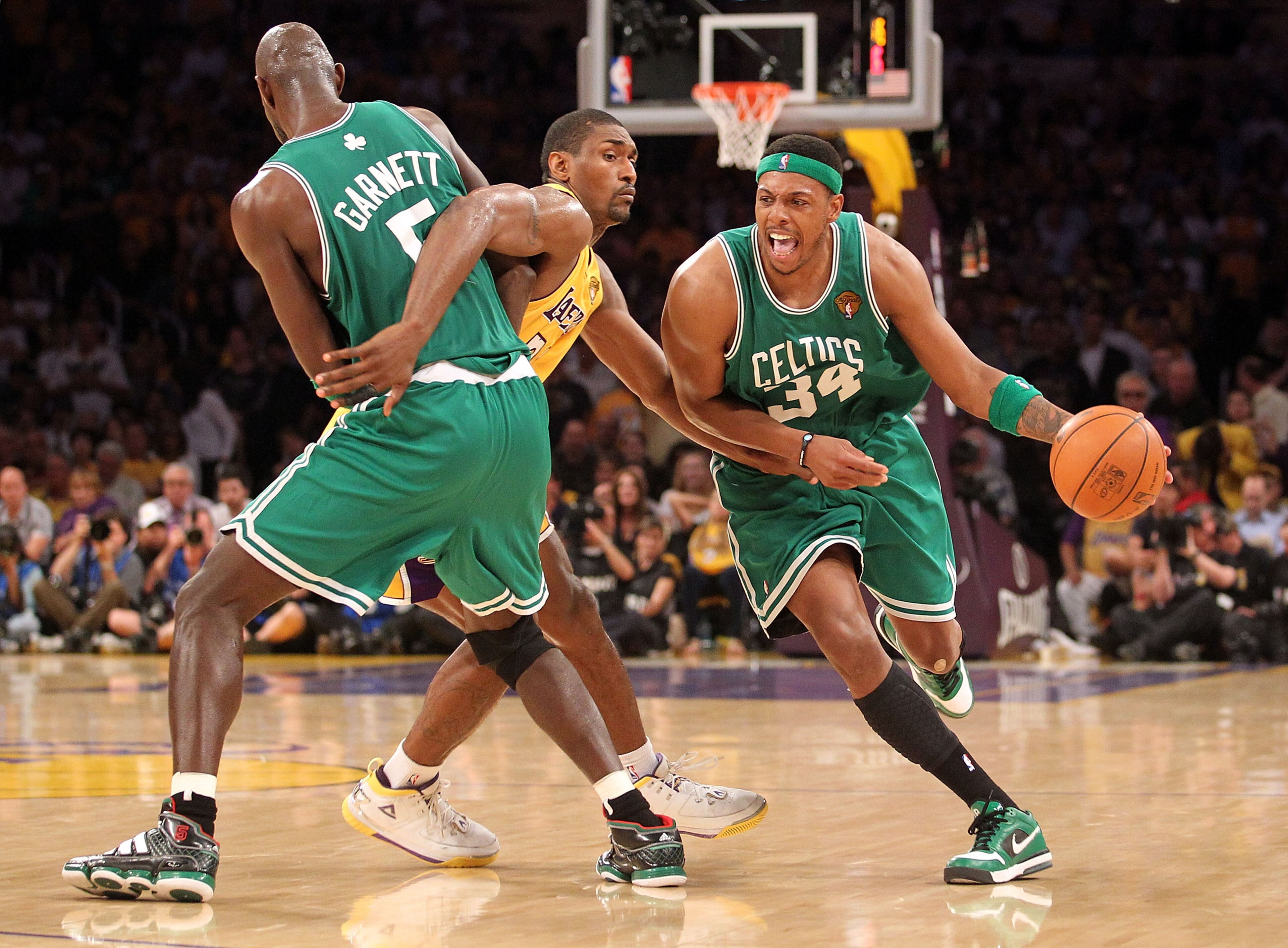 LOS ANGELES, CA - JUNE 17:  Ray Allen #20 of the Boston Celtics moves the ball as Ron Artest #37 of the Los Angeles Lakers is screened by Kevin Garnett #5 of the Celtics in the third quarter of Game Seven of the 2010 NBA Finals at Staples Center on June 1
