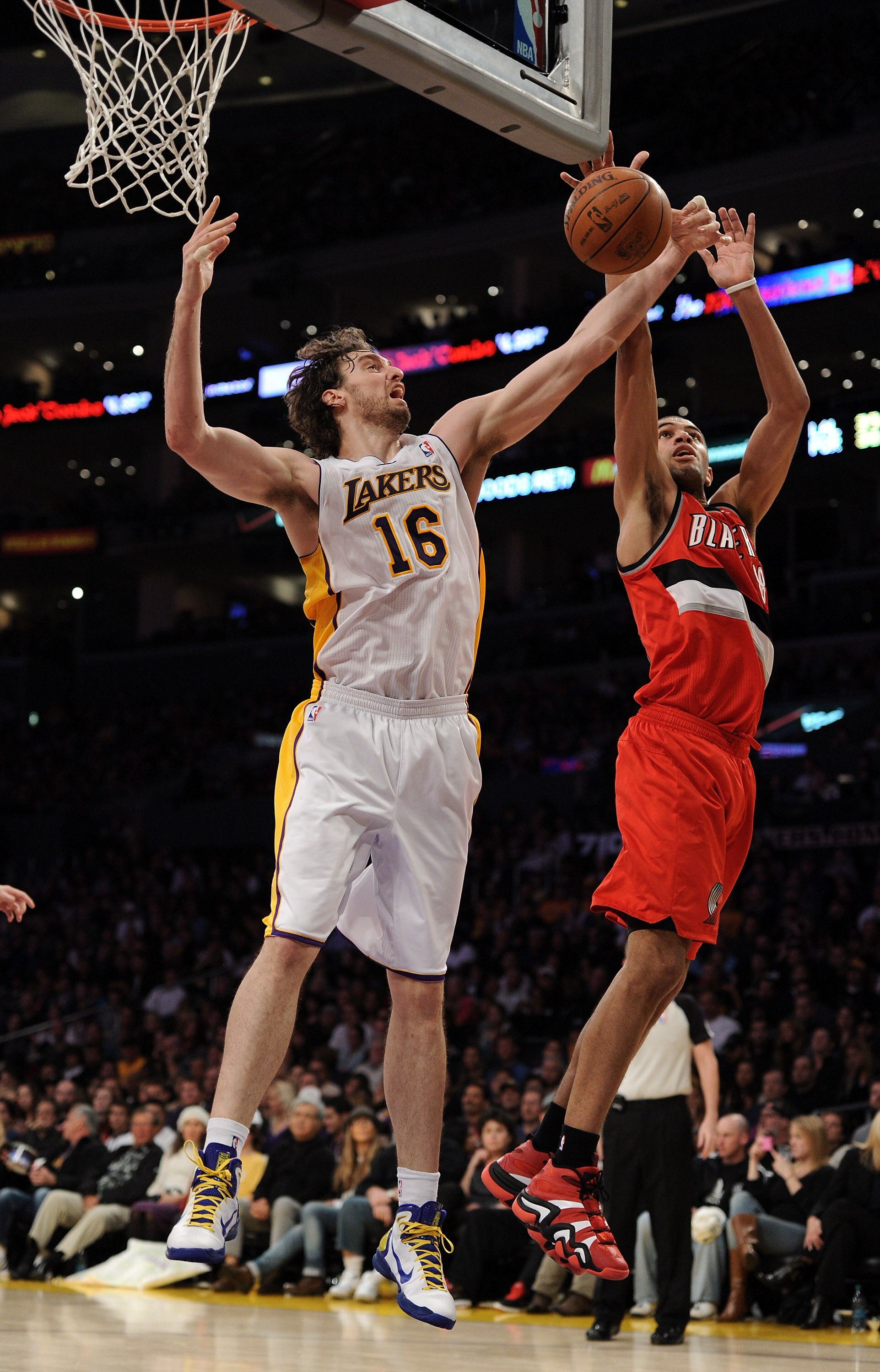 LOS ANGELES, CA - MARCH 20:  Pau Gasol #16 of the Los Angeles Lakers and Nicolas Batum #88 of the Portland Trail Blazers jump for a rebound at the Staples Center on March 20, 2011 in Los Angeles, California.  NOTE TO USER: User expressly acknowledges and