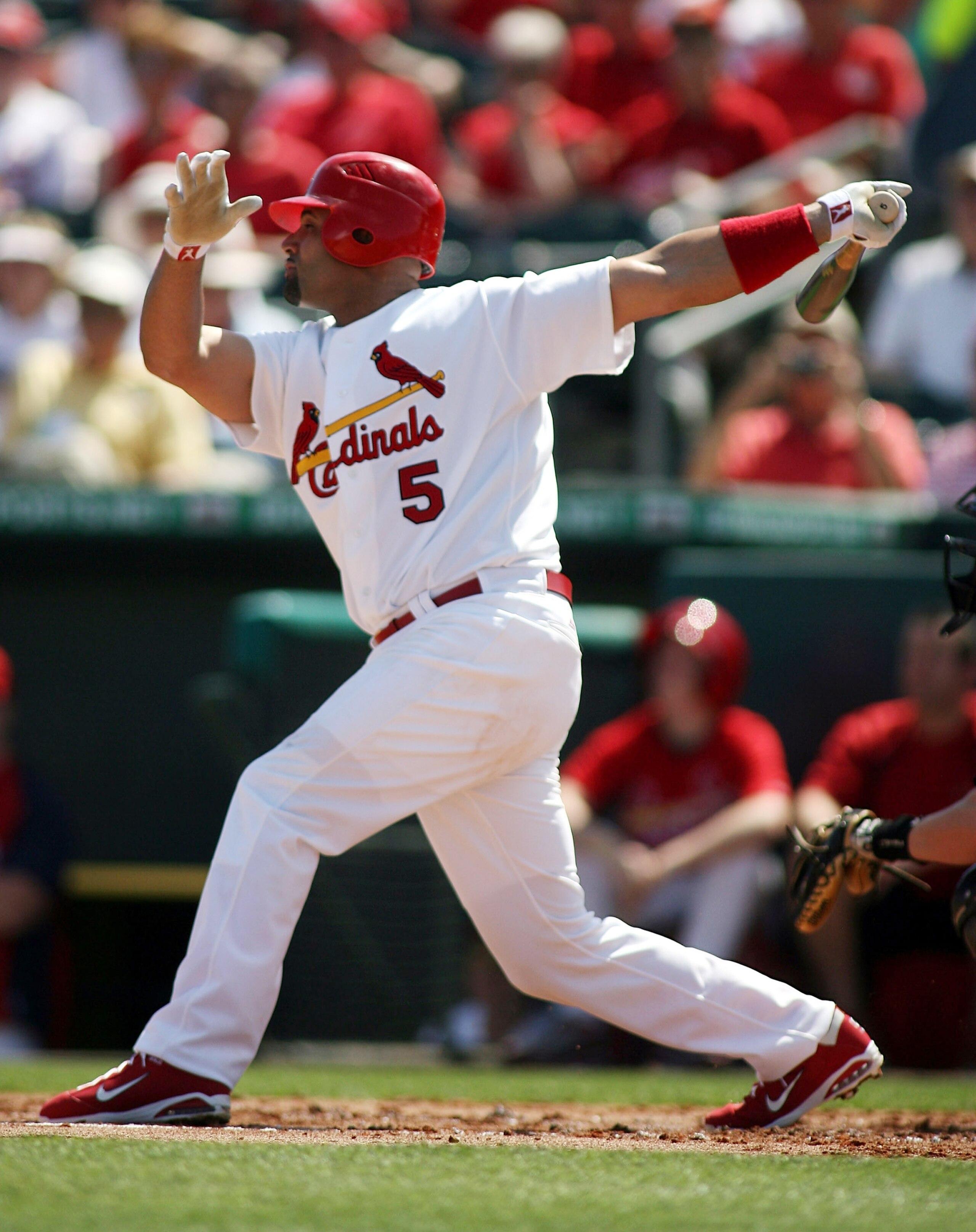 JUPITER, FL - FEBRUARY 28:  Albert Pujols #5 of the St. Louis Cardinals swings against the Florida Marlins at Roger Dean Stadium on February 28, 2011 in Jupiter, Florida.  (Photo by Marc Serota/Getty Images)