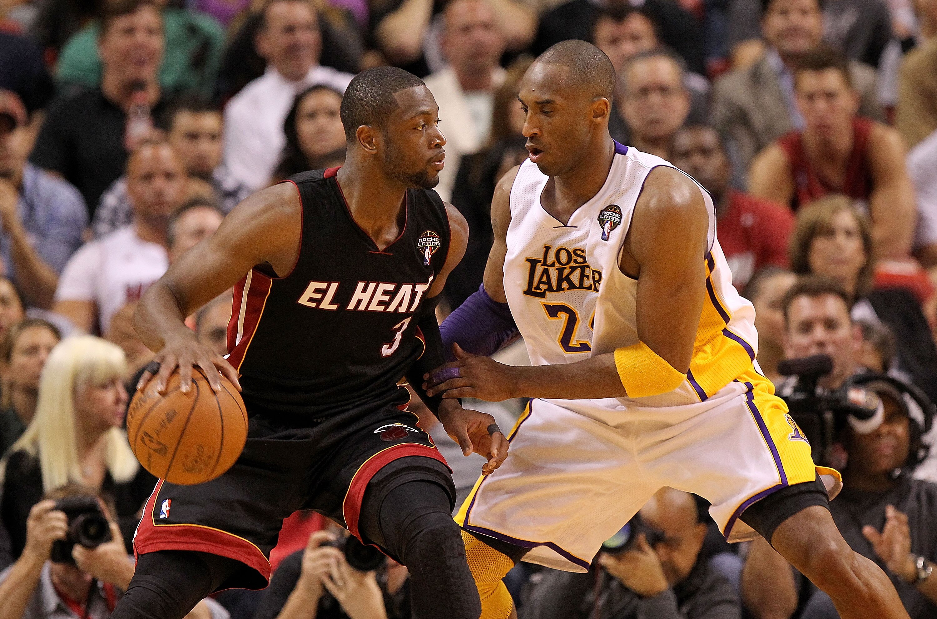 MIAMI, FL - MARCH 10:  Dwyane Wade #3 of the Miami Heat posts up Kobe Bryant #24 of the Los Angeles Lakers during a game at American Airlines Arena on March 10, 2011 in Miami, Florida. NOTE TO USER: User expressly acknowledges and agrees that, by download
