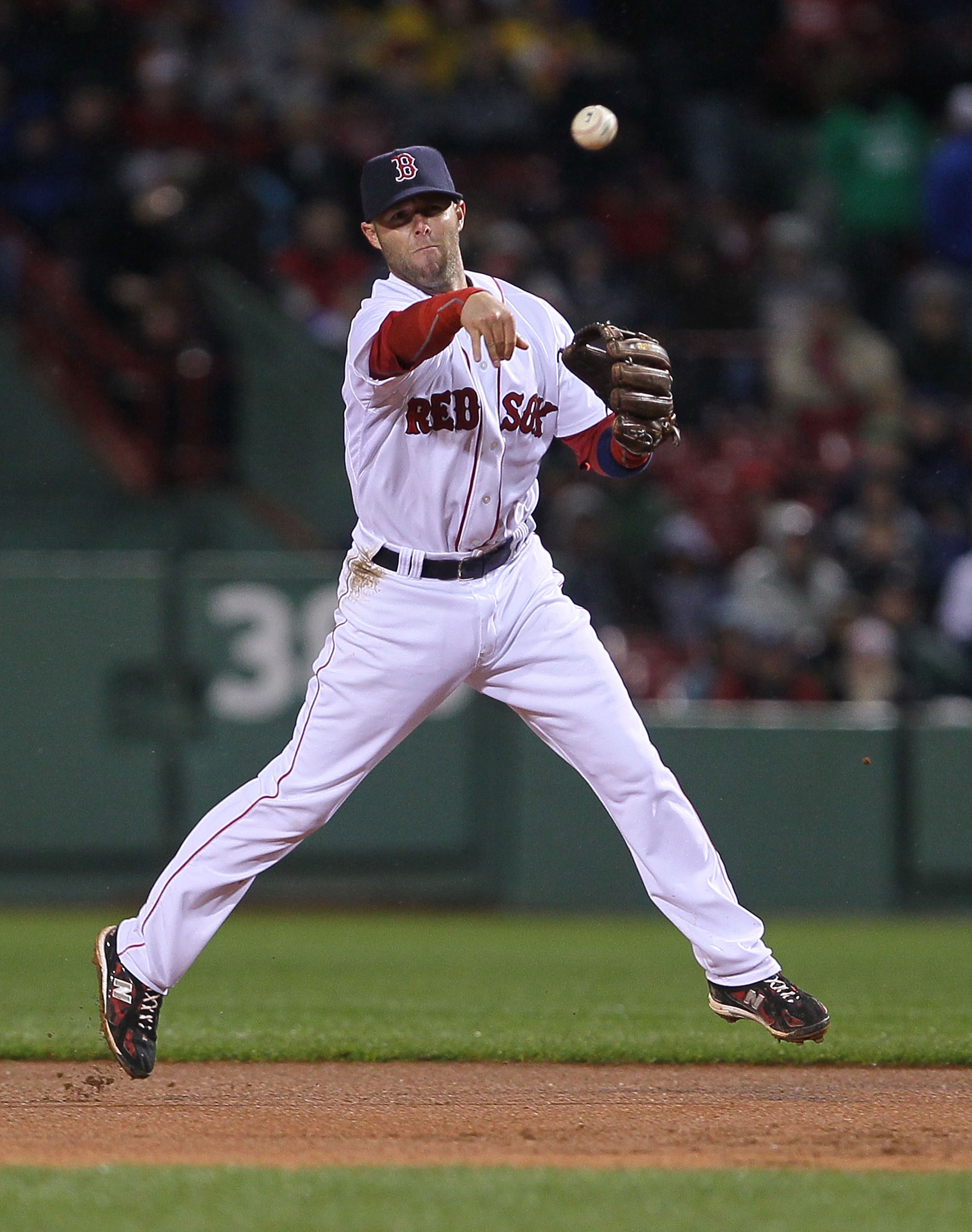 BOSTON - APRIL 17:  Dustin Pedroia #15of the Boston Red Sox maes an assist against the Tampa Bay Rays at Fenway Park on April 17, 2010 in Boston, Massachusetts. (Photo by Jim Rogash/Getty Images)