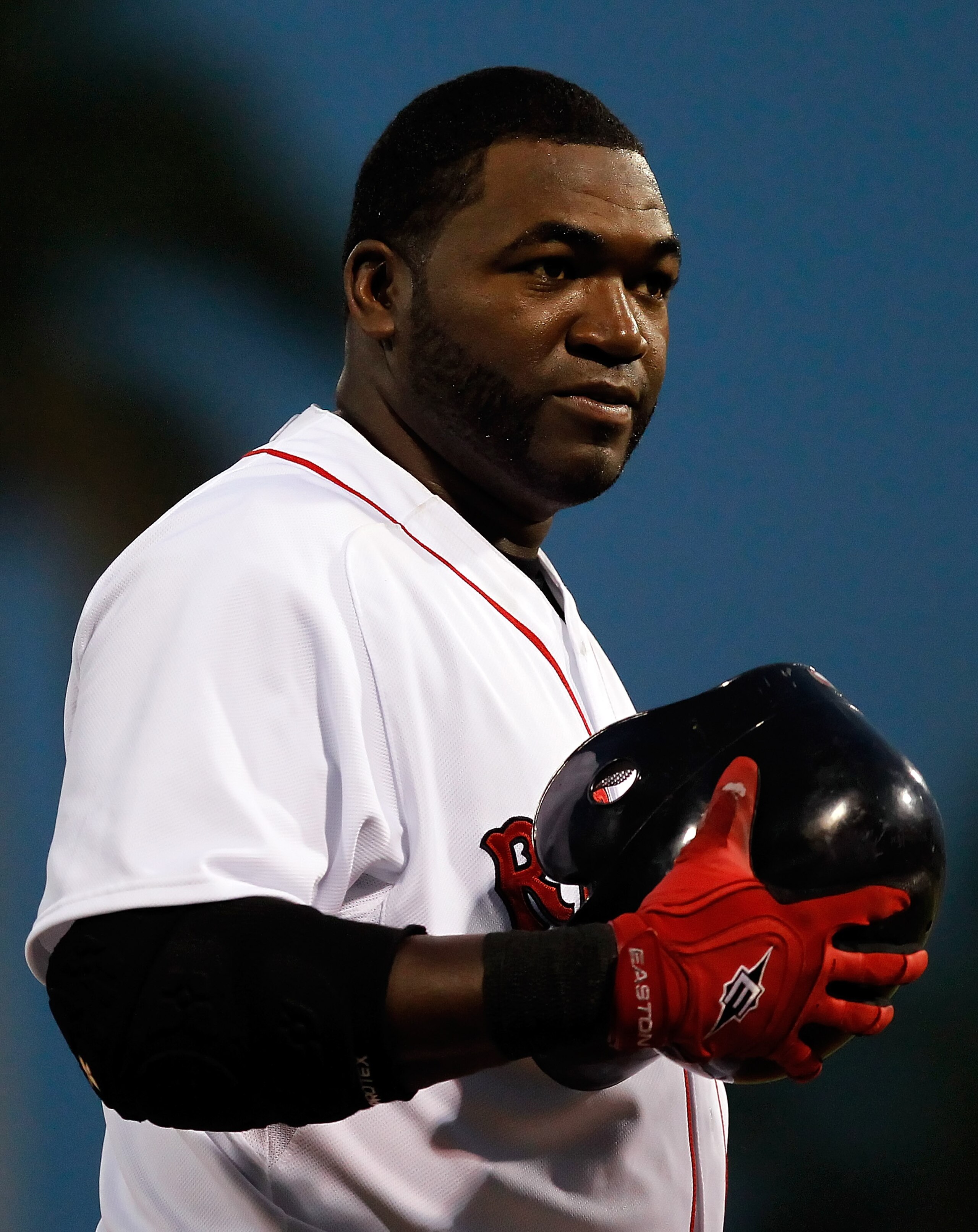 FORT MYERS, FL - MARCH 14:  Designated hitter David Ortiz #34 of the Boston Red Sox smiles after an inning against the New York Yankees during a Grapefruit League Spring Training Game at City of Palms Park on March 14, 2011 in Fort Myers, Florida.  (Photo