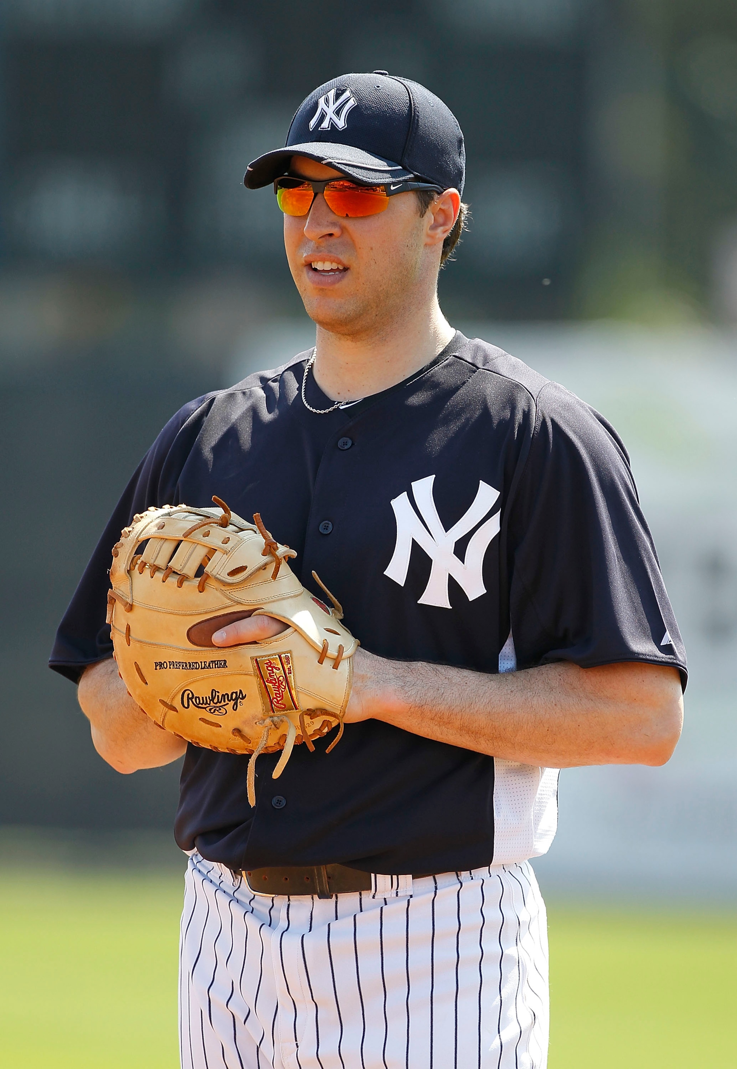 TAMPA, FL - FEBRUARY 20:  Mark Teixeira #25 of the New York Yankees fields ground balls during the first full team workout of Spring Training on February 20, 2011 at the George M. Steinbrenner Field in Tampa, Florida.  (Photo by Leon Halip/Getty Images)