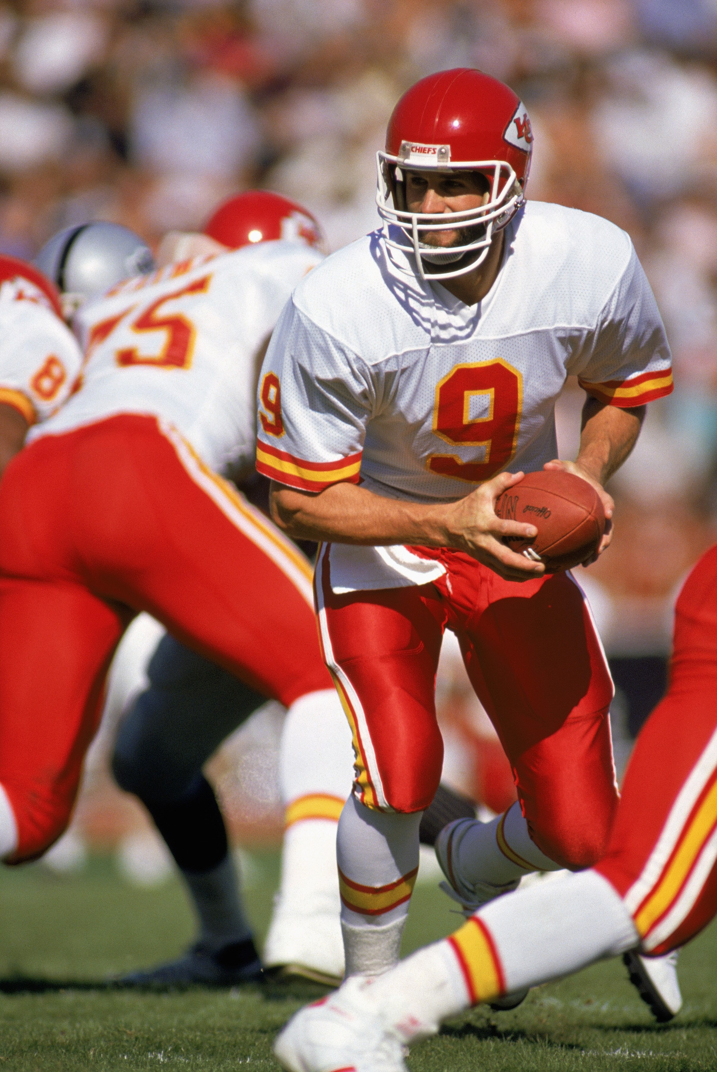 LOS ANGELES - 1988:  Quarterback Bill Kenney #9 of the Kansas City Chiefs scrambles during a 1988 NFL game against the Los Angeles Raiders at the LA Memorial Coliseum in Los Angeles, California.  (Photo by Mike Powell/Getty Images)