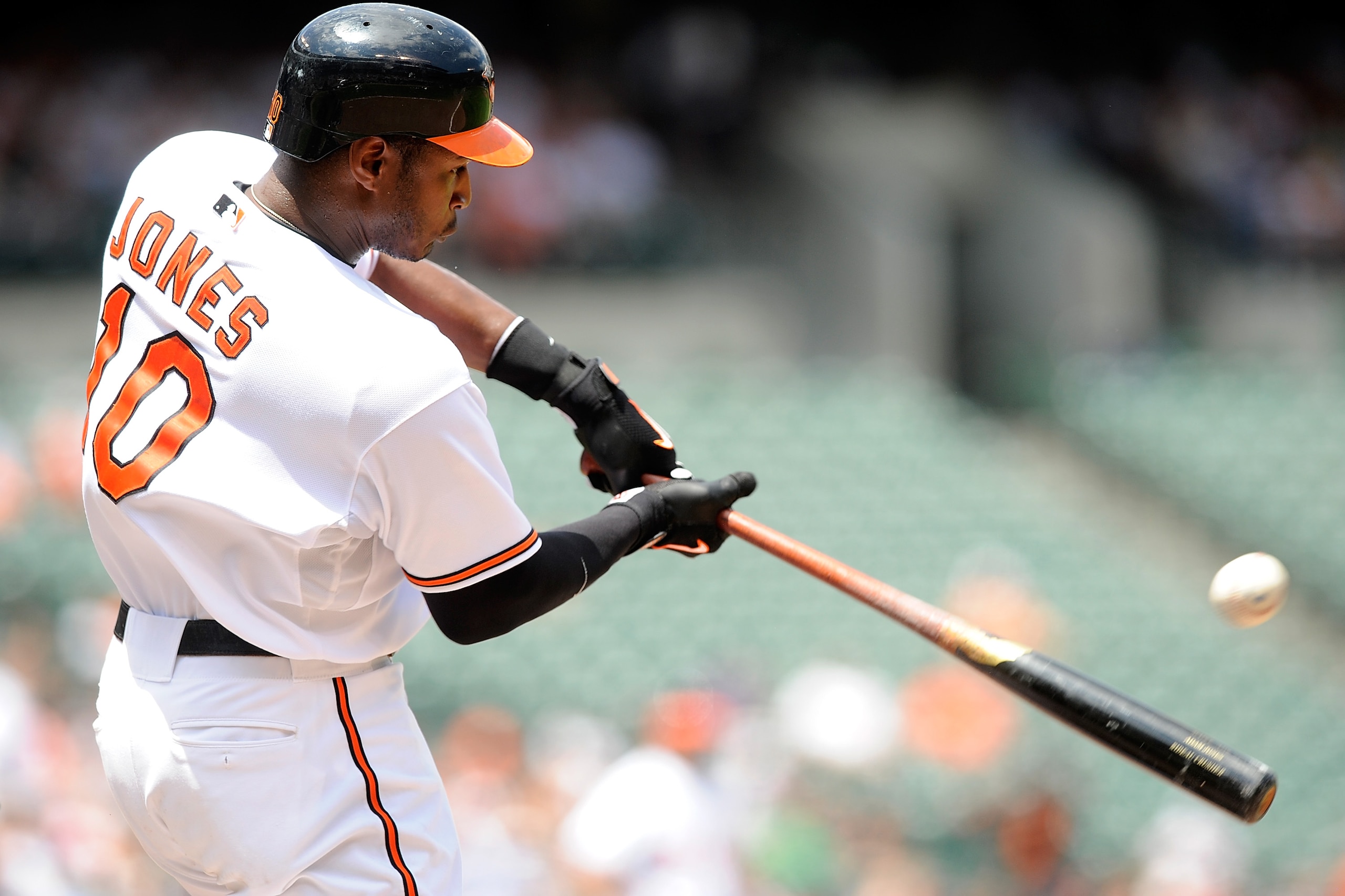 BALTIMORE - JULY 21:  Adam Jones #10 of the Baltimore Orioles hits a single in the fourth inning against the Tampa Bay Rays at Camden Yards on July 21, 2010 in Baltimore, Maryland.  (Photo by Greg Fiume/Getty Images)