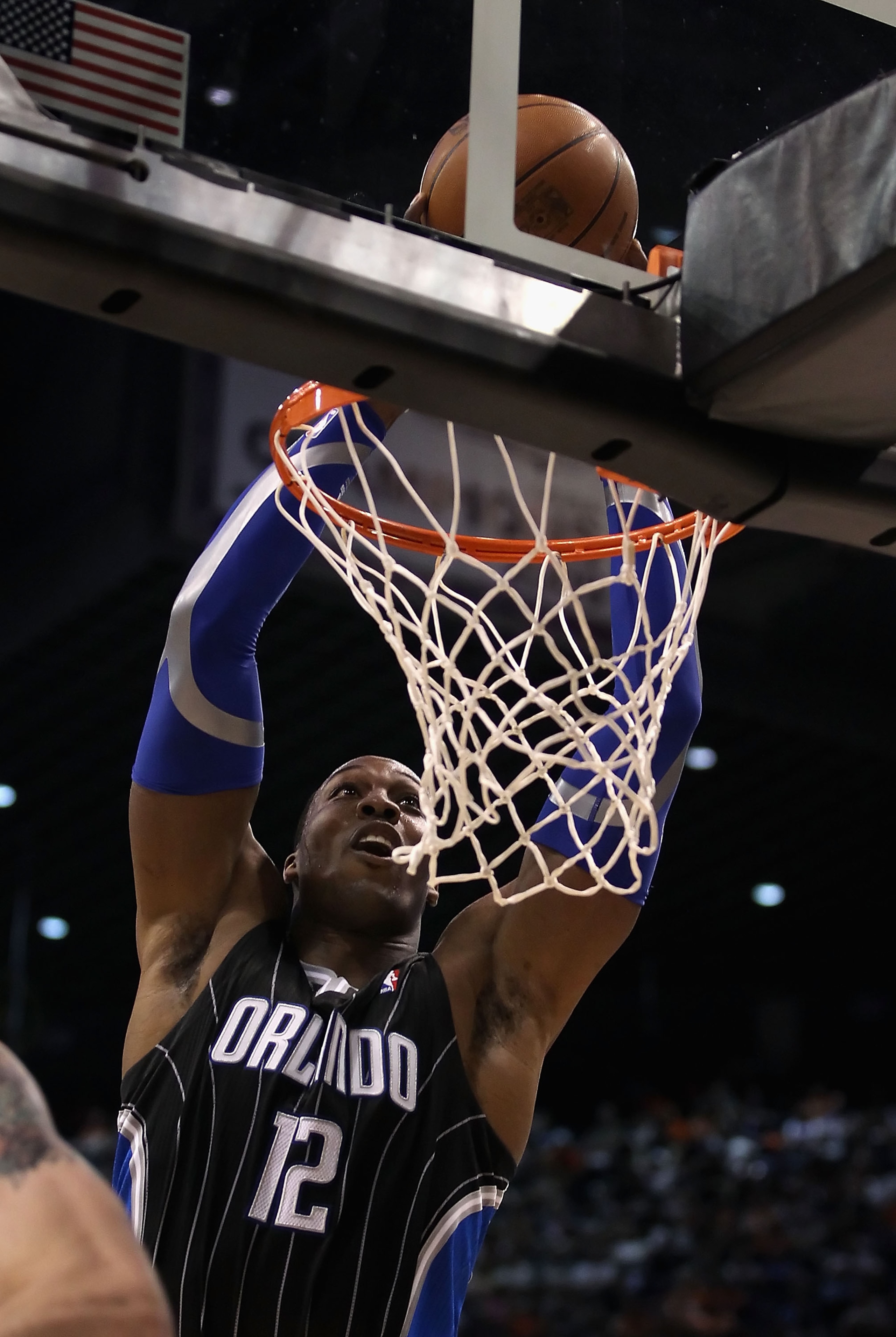 PHOENIX, AZ - MARCH 13:  Dwight Howard #12 of the Orlando Magic slam dunks the ball during the NBA game against the Phoenix Suns at US Airways Center on March 13, 2011 in Phoenix, Arizona. The Magic defeated the Suns 111-88. NOTE TO USER: User expressly a