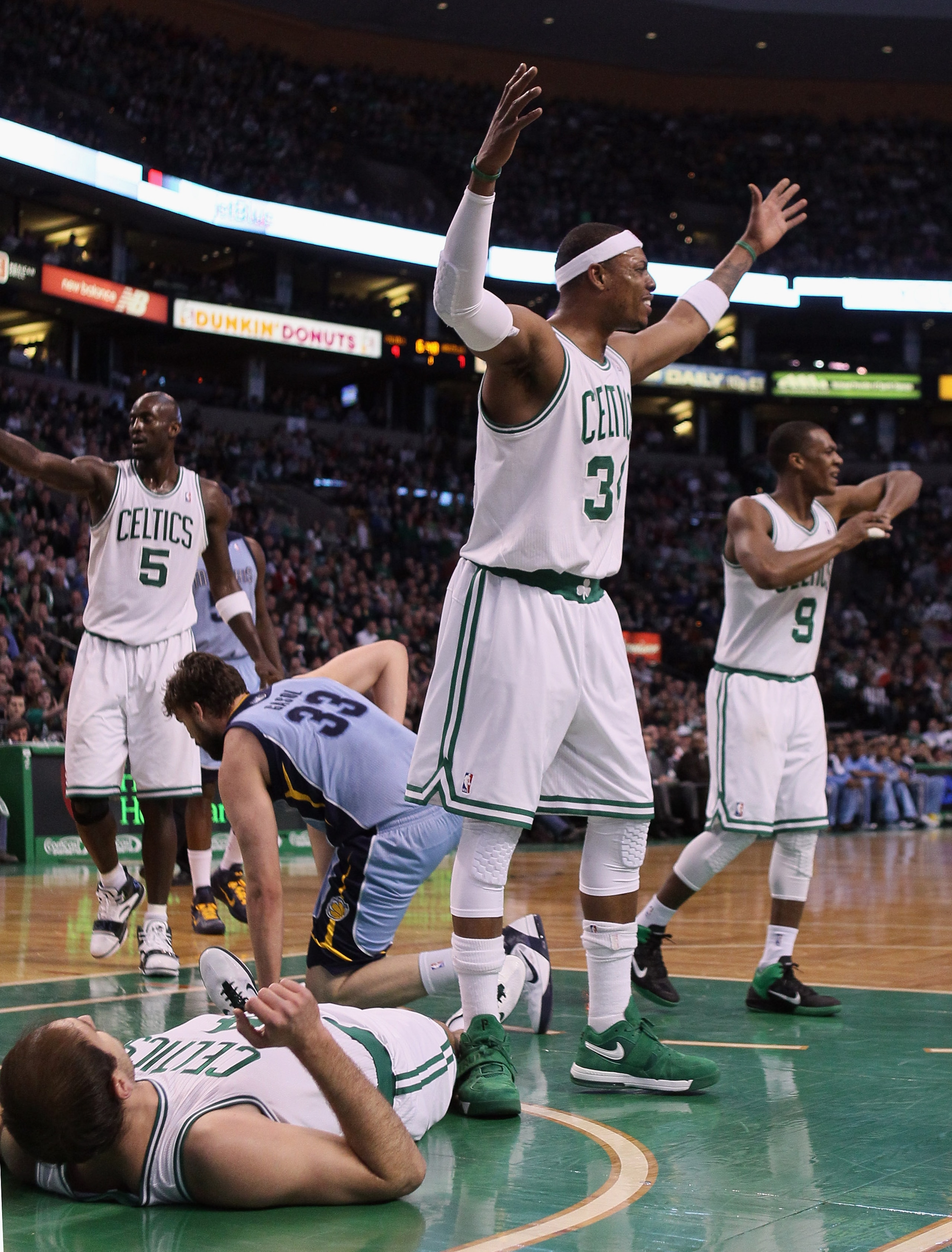 BOSTON, MA - MARCH 23:  Paul Pierce #34 and Rajon Rondo #9 of the Boston Celtics react after teammate Nenad Krstic #4 is called for a foul in the first half against the Memphis Grizzlies on March 23, 2011 at the TD Garden in Boston, Massachusetts.  NOTE T