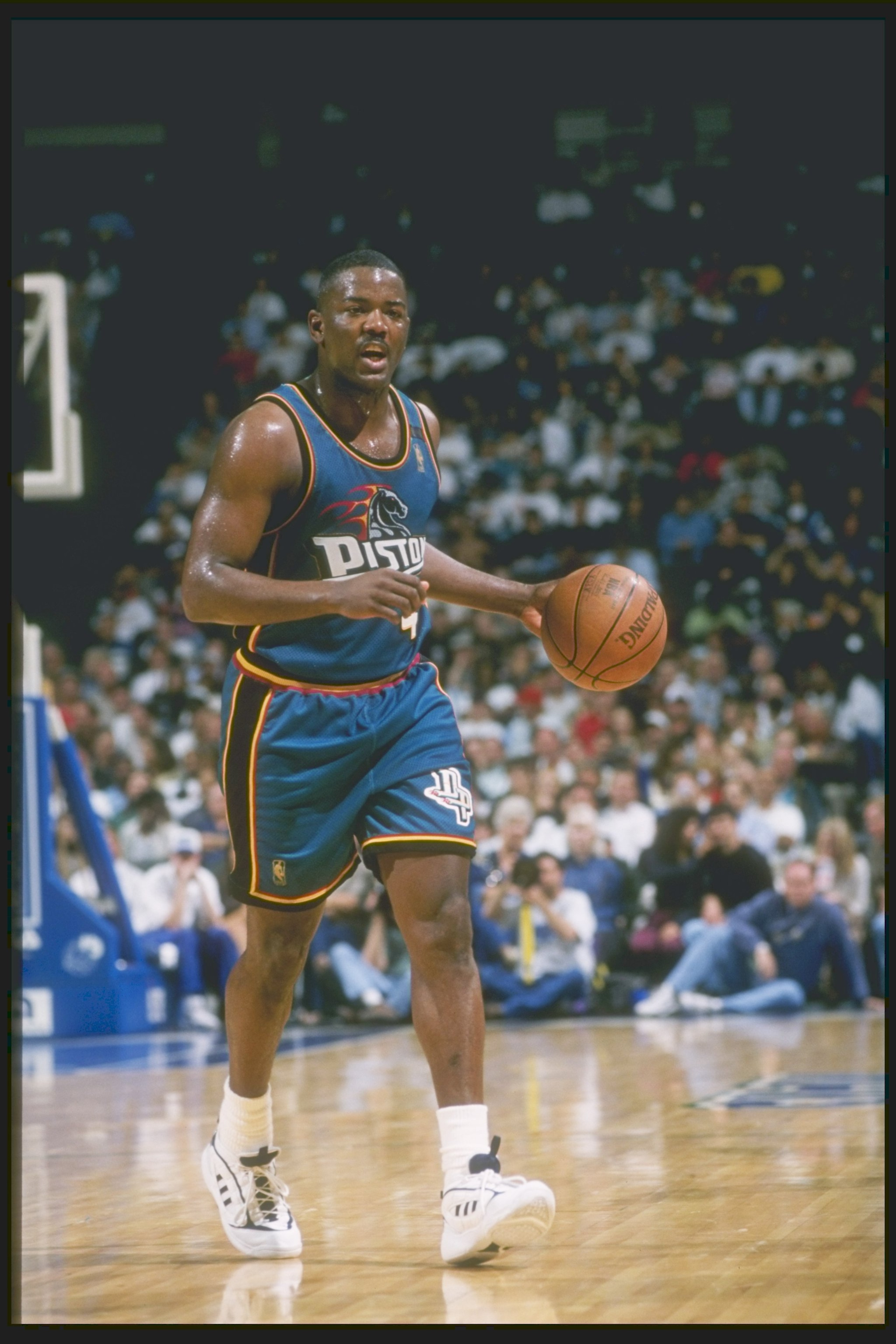 Guard Joe Dumars of the Detroit Pistons dribbles the ball down the court during a game against the Dallas Mavericks at Reunion Arena in Dallas, Texas. The Pistons won the game 100-82. Guard Joe Dumars of the Detroit Pistons dribbles the ball down the court during a game against the Dallas Mavericks at Reunion Arena in Dallas, Texas. The Pistons won the game 100-82.
