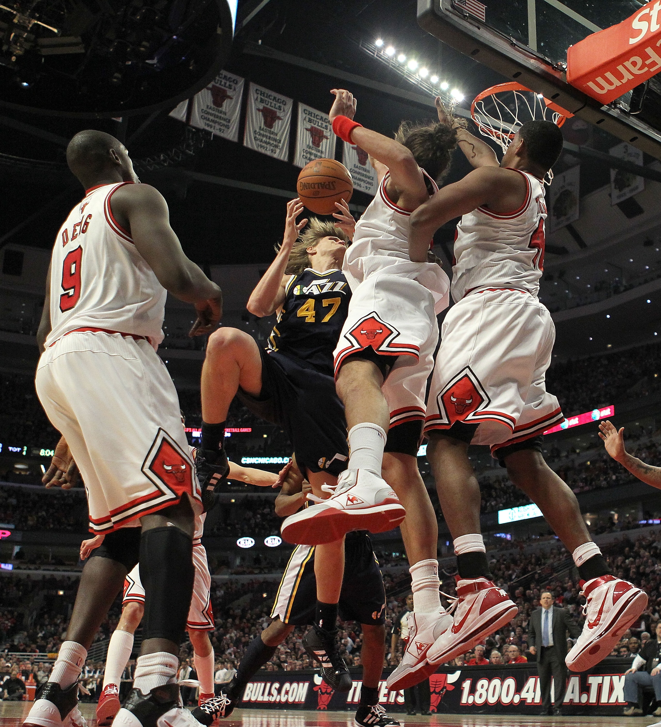 CHICAGO, IL - MARCH 12: (L-R) Loul Deng #9, Joakim Noah #13 and Kurt Thomas #40 of the Chicago Bulls collapse on Andrei Kirilenko #47 of the Utah Jazz and force him to lose the ball at the United Center on March 12, 2011 in Chicago, Illinois. The Bulls de