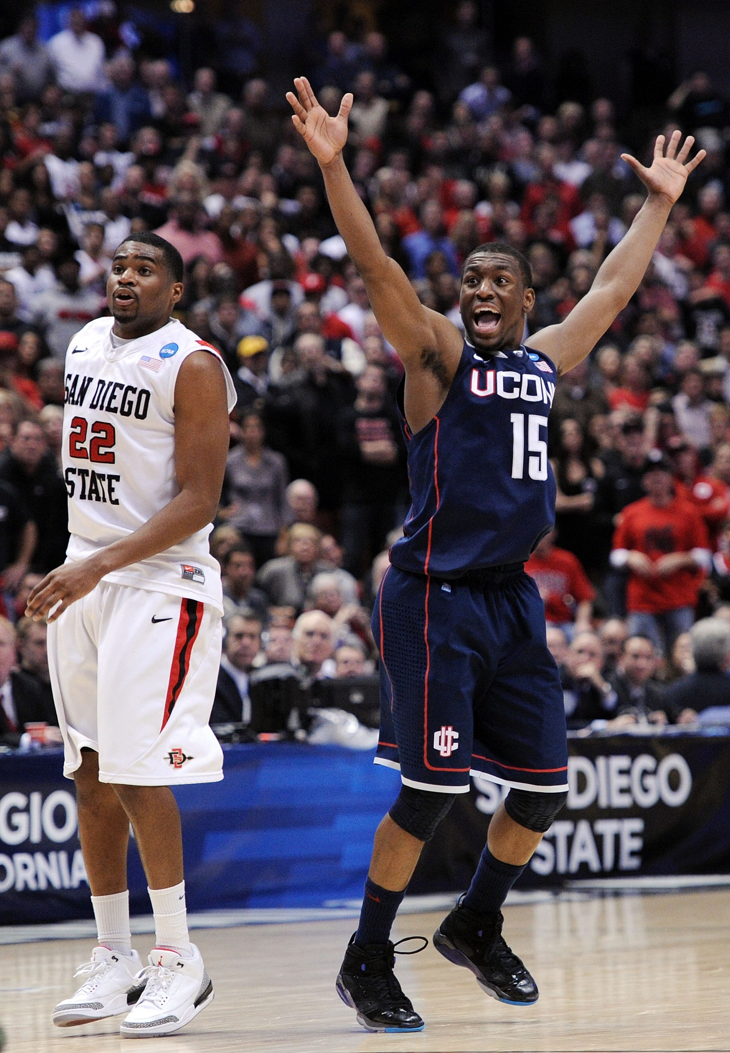 ANAHEIM, CA - MARCH 24:  Kemba Walker #15 of the Connecticut Huskies reacts after making a play late in the game as Chase Tapley #22 of the San Diego State Aztecs looks on during the west regional semifinal of the 2011 NCAA men's basketball tournament at