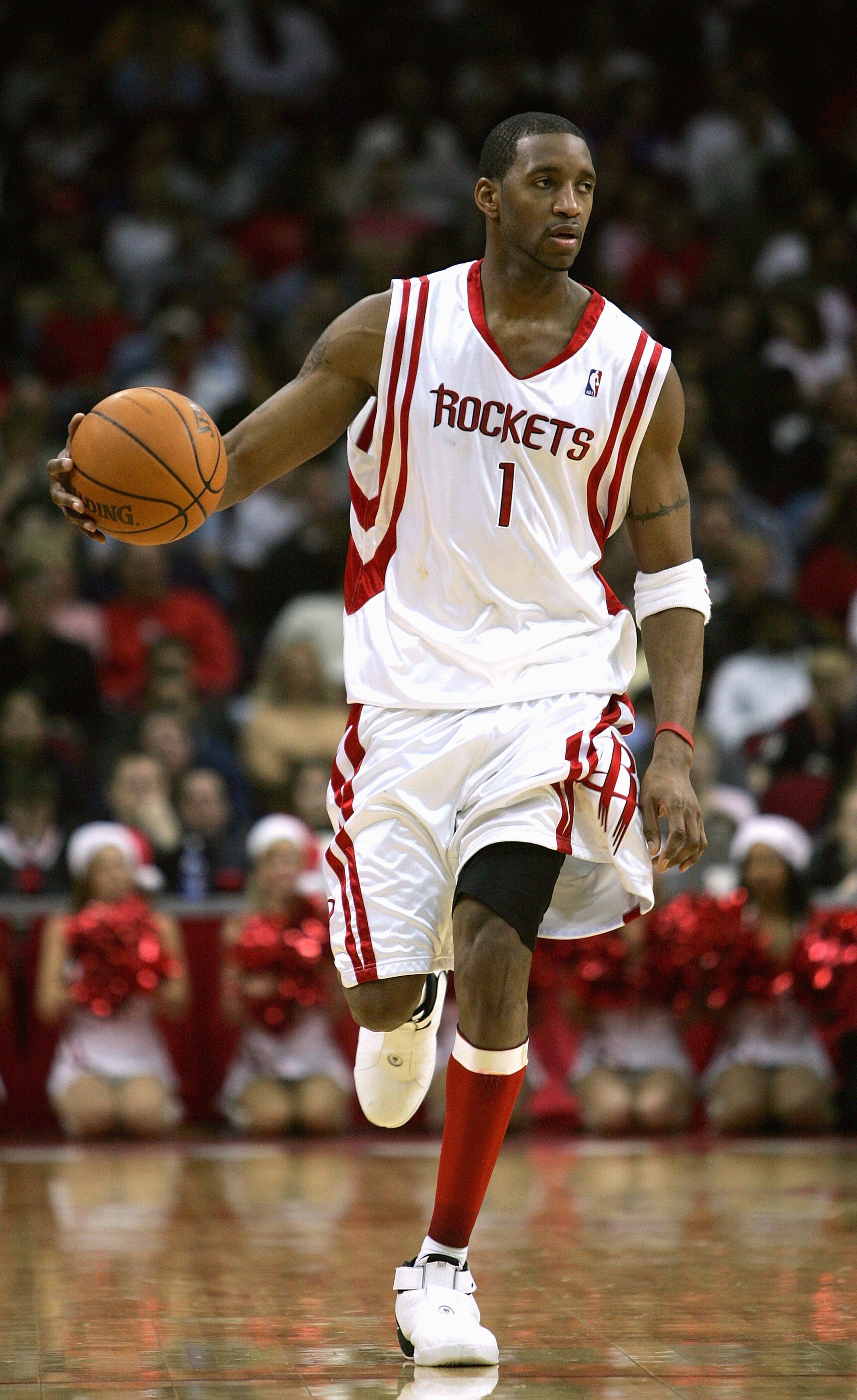 HOUSTON - DECEMBER 11: Tracy McGrady #1 of the Houston Rockets dribbles against the Dallas Mavericks on December 11, 2004 at the Toyota Center in Houston, Texas. The Mavericks won 102-78. NOTE TO USER: User expressly acknowledges and agrees that, by do HOUSTON - DECEMBER 11: Tracy McGrady #1 of the Houston Rockets dribbles against the Dallas Mavericks on December 11, 2004 at the Toyota Center in Houston, Texas. The Mavericks won 102-78. NOTE TO USER: User expressly acknowledges and agrees that, by do