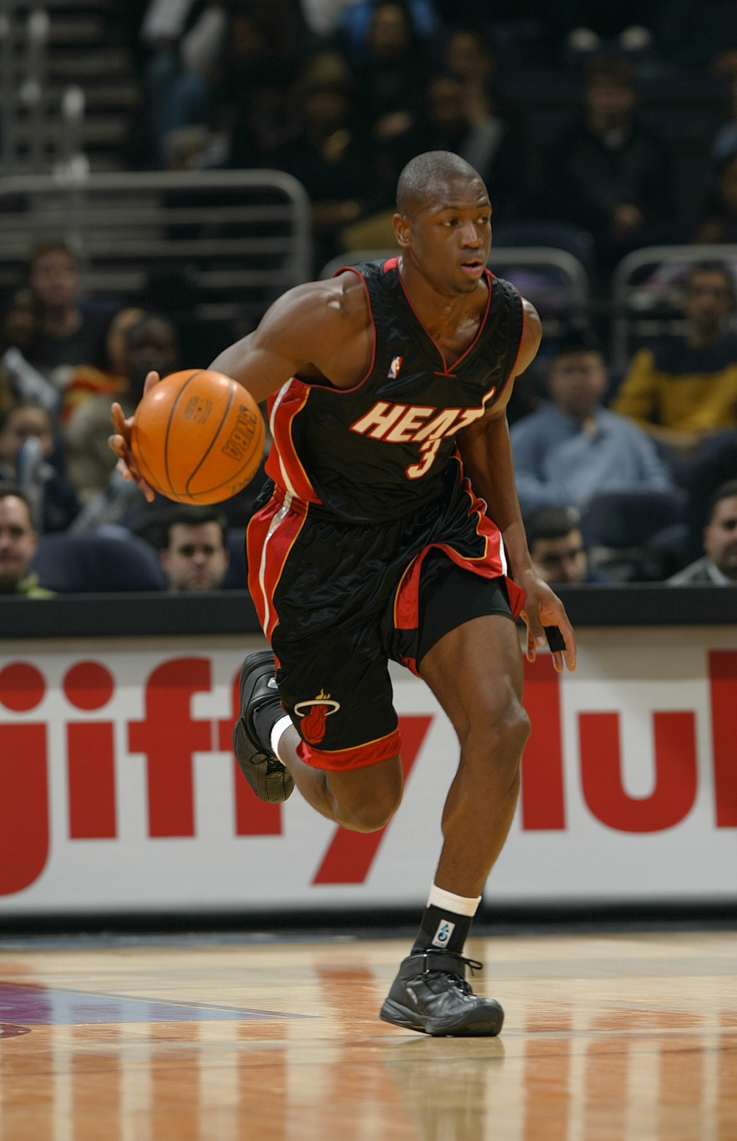 WASHINGTON - DECEMBER 26: Dwyane Wade #3 of the Miami Heat moves the ball during the game against the Washington Wizards at the MCI Center on December 26, 2003 in Washington, DC. The Heat won 92-84. NOTE TO USER: User expressly acknowledges and agrees WASHINGTON - DECEMBER 26: Dwyane Wade #3 of the Miami Heat moves the ball during the game against the Washington Wizards at the MCI Center on December 26, 2003 in Washington, DC. The Heat won 92-84. NOTE TO USER: User expressly acknowledges and agrees