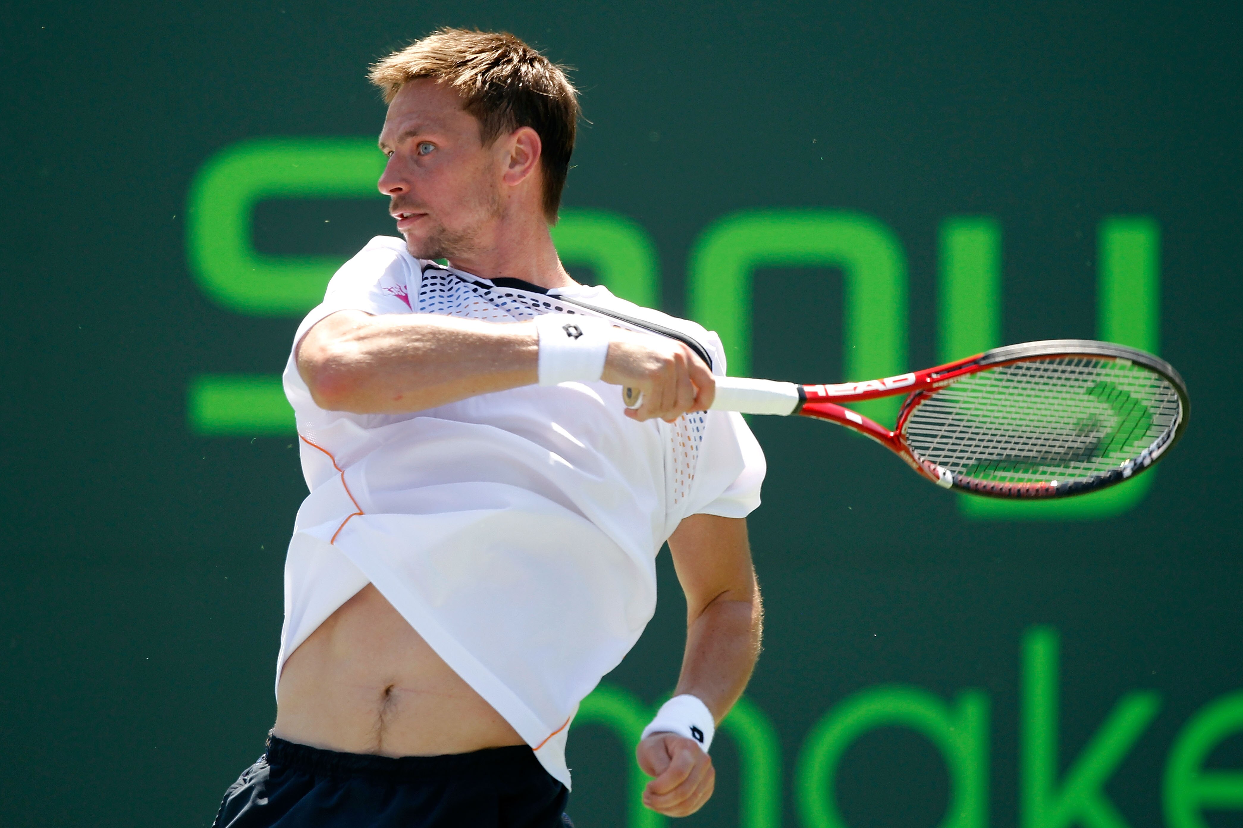 KEY BISCAYNE, FL - MARCH 25:  Robin Soderling of Sweden follows through on a return against Ivan Dodig of Crotia during the Sony Ericsson Open at Crandon Park Tennis Center on March 25, 2011 in Key Biscayne, Florida.  (Photo by Matthew Stockman/Getty Imag