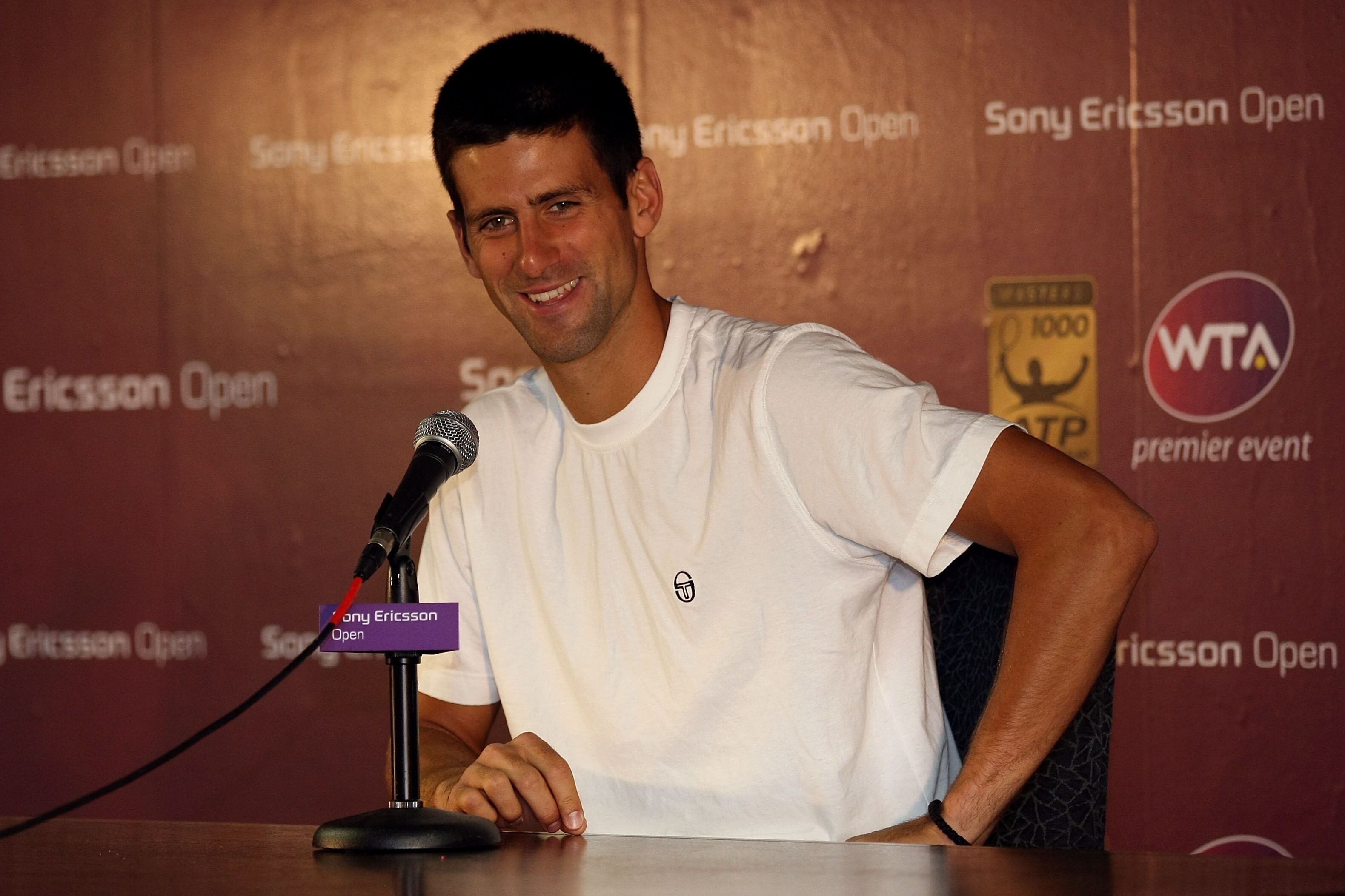 KEY BISCAYNE, FL - MARCH 24:  Novak Djokovic of Serbia answers questions from the media at a press conference during the Sony Ericsson Open at Crandon Park Tennis Center on March 24, 2011 in Key Biscayne, Florida.  (Photo by Chris Chambers/Getty Images)