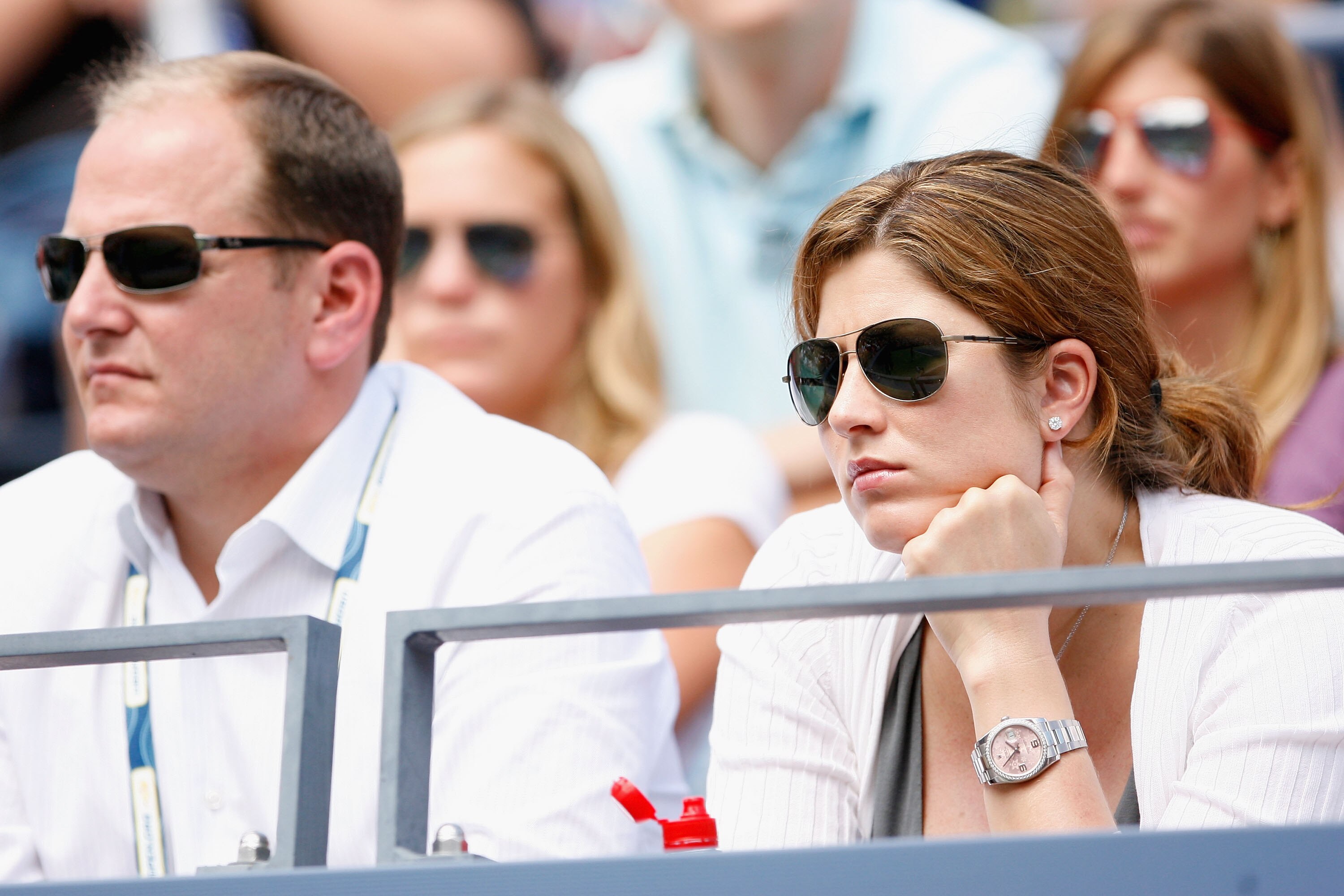 NEW YORK - AUGUST 31:  Mirka Federer (R), wife of Roger Federer of Switzerland and Roger Federer's agent Tony Godsick look on during his men's singles Round 1 match during day one of the 2009 U.S. Open at the USTA Billie Jean King National Tennis Center o