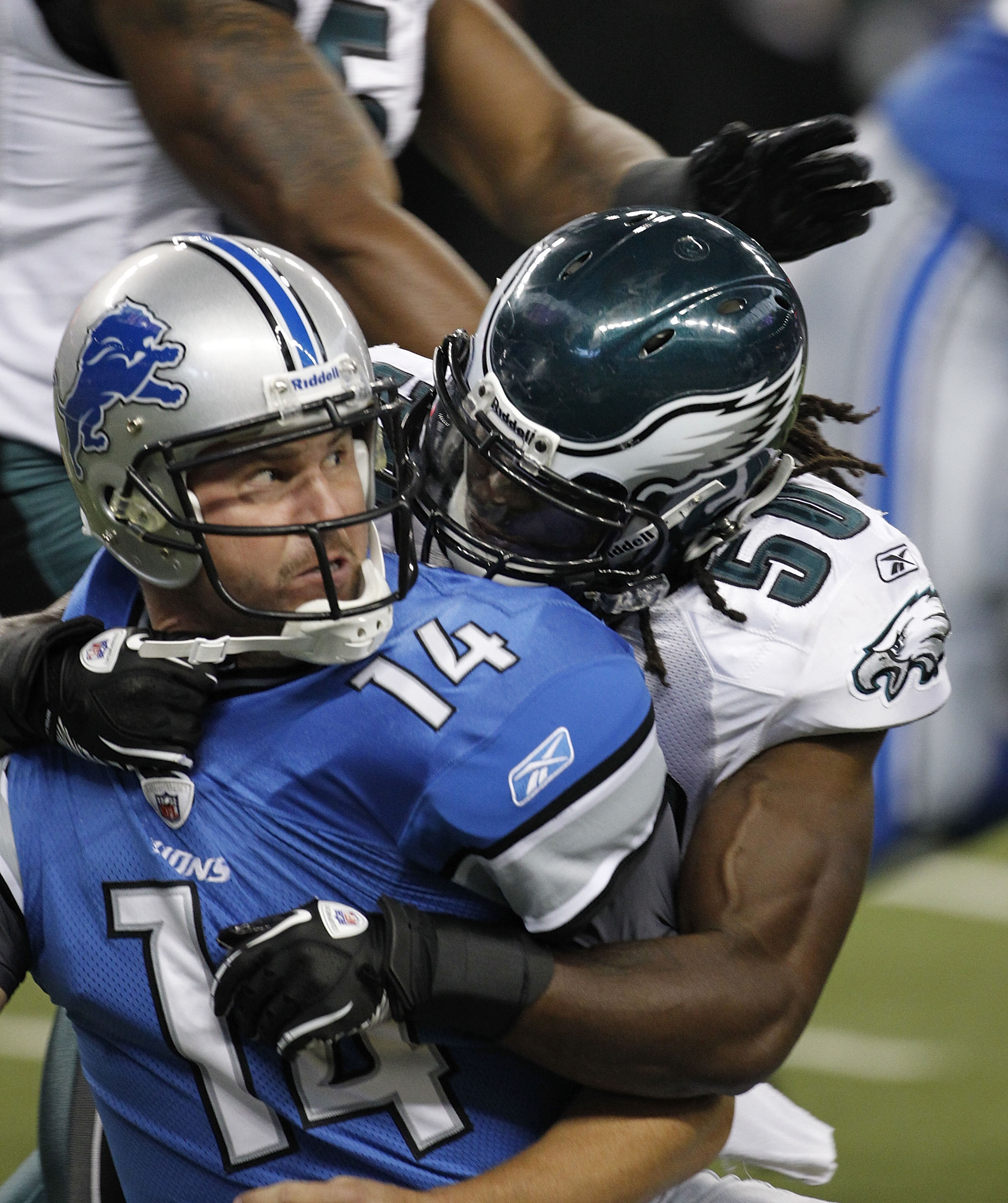 DETROIT - SEPTEMBER 19:  Shaun Hill #14 of the Detroit Lions is sacked by Ernie Sims #50 during the game against the Philadelphia Eagles at Ford Field on September 19, 2010 in Detroit, Michigan. The Eagles defeated the Lions 35-32.  (Photo by Leon Halip/G