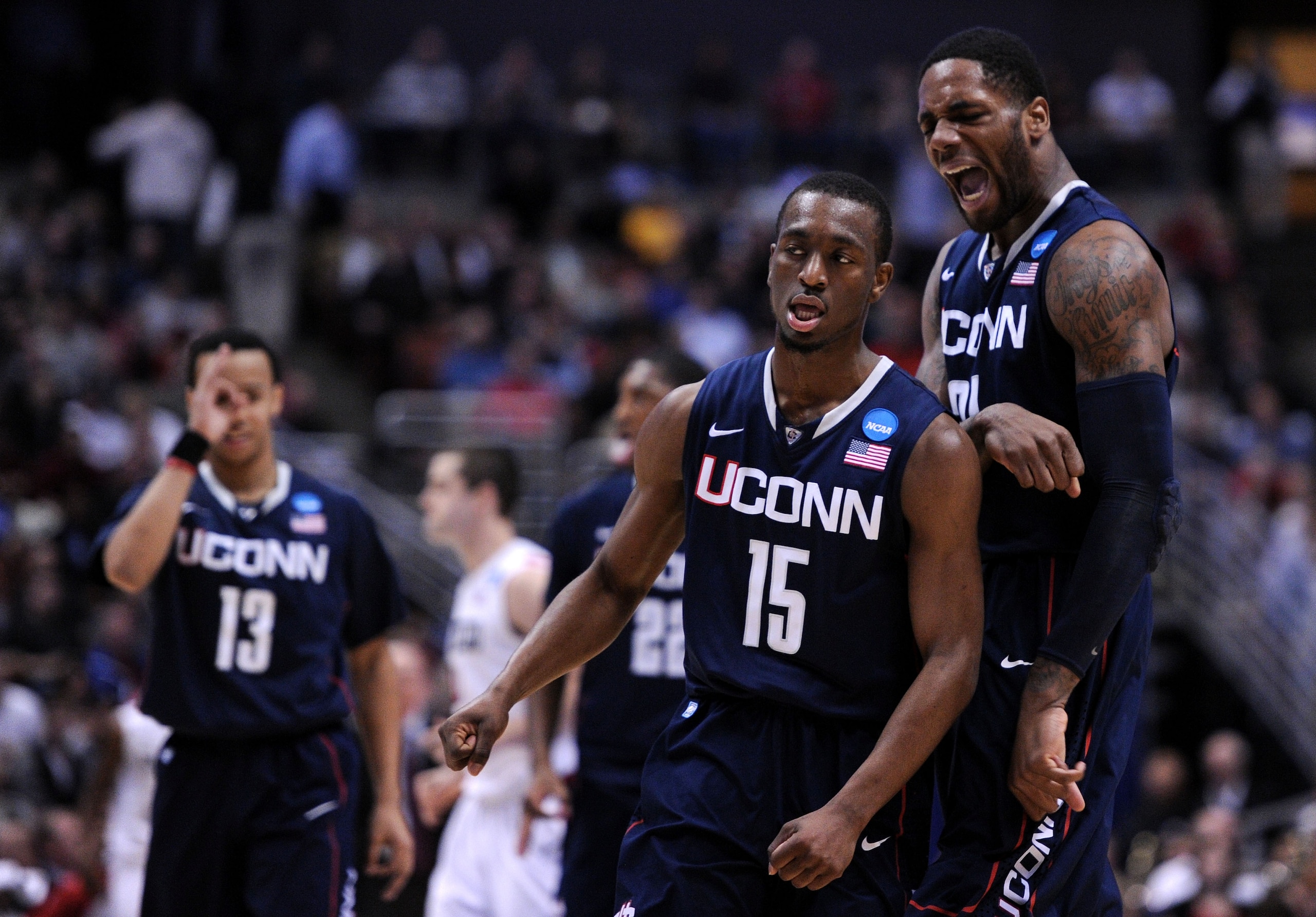 ANAHEIM, CA - MARCH 24:  Kemba Walker #15 and Alex Oriakhi #34 of the Connecticut Huskies celebrate after a play against the San Diego State Aztecs during the west regional semifinal of the 2011 NCAA men's basketball tournament at the Honda Center on Marc