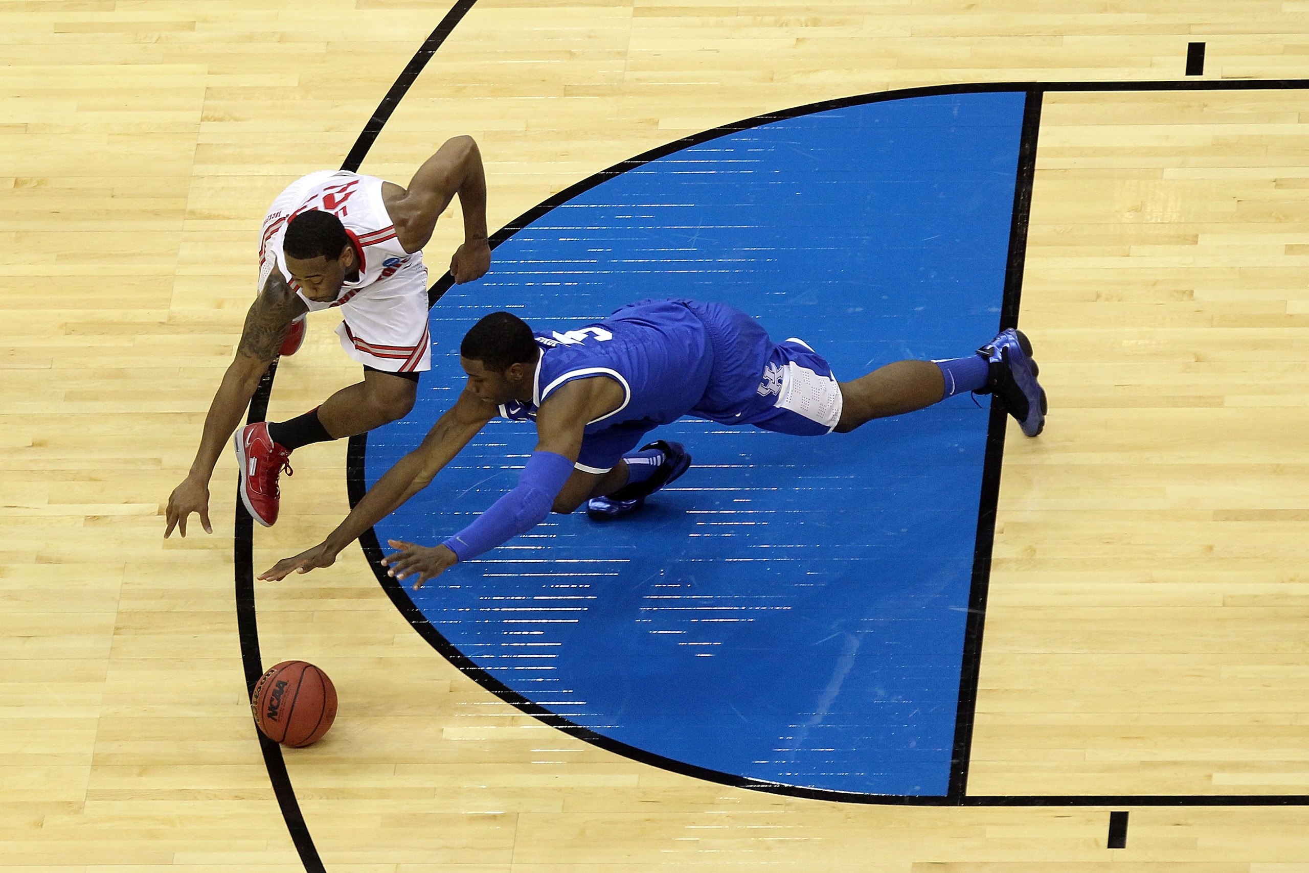 NEWARK, NJ - MARCH 25:  David Lighty #23 of the Ohio State Buckeyes fights for the ball against Terrence Jones #3 of the Kentucky Wildcats during the first half of the east regional semifinal of the 2011 NCAA Men's Basketball Tournament at the Prudential