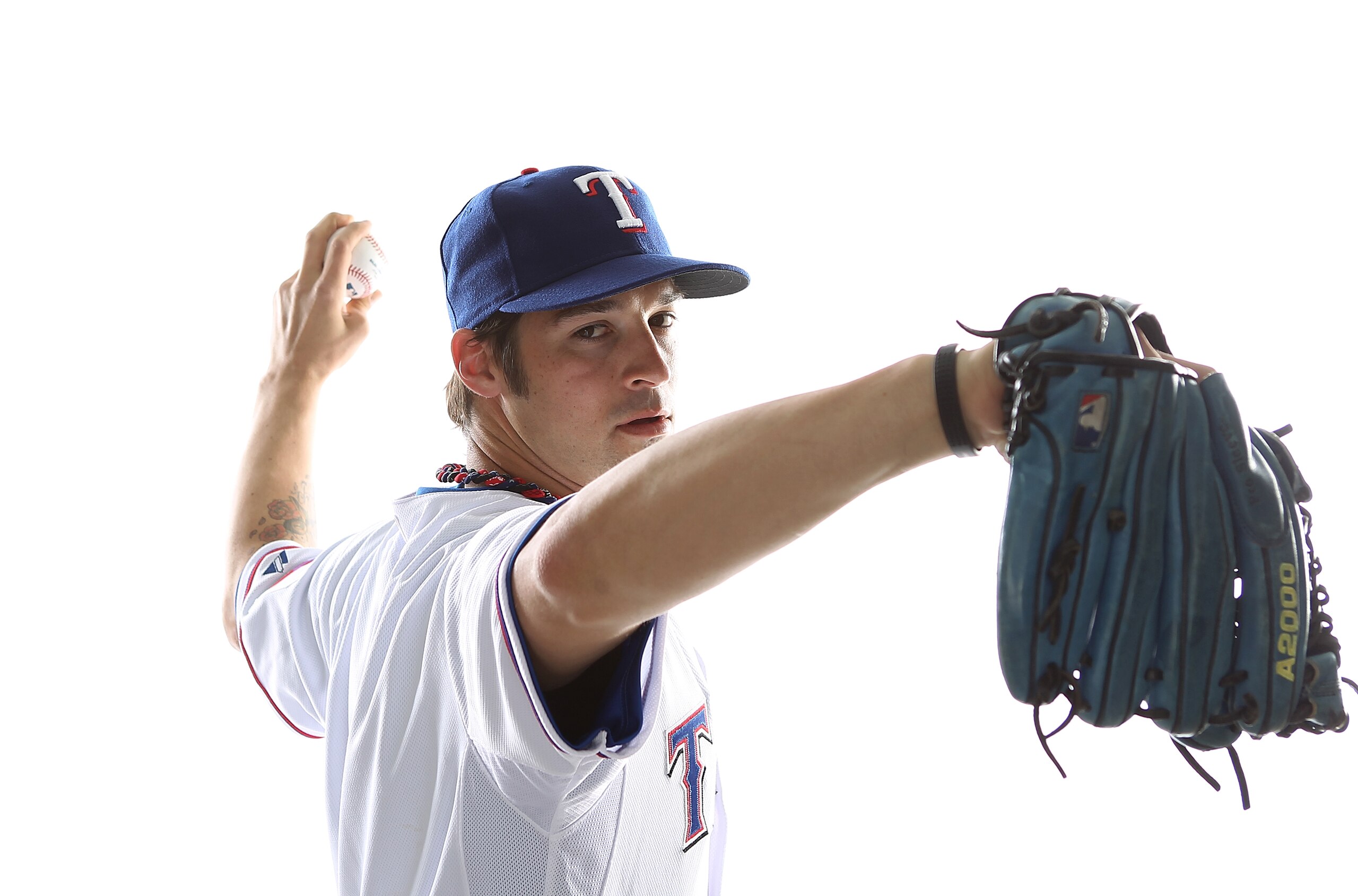 SURPRISE, AZ - FEBRUARY 25: C. J. Wilson #36 of the Texas Rangers poses for a portrait during Spring Training Media Day on February 25, 2011 at Surprise Stadium in Surprise, Arizona. (Photo by Jonathan Ferrey/Getty Images) SURPRISE, AZ - FEBRUARY 25: C. J. Wilson #36 of the Texas Rangers poses for a portrait during Spring Training Media Day on February 25, 2011 at Surprise Stadium in Surprise, Arizona. (Photo by Jonathan Ferrey/Getty Images)