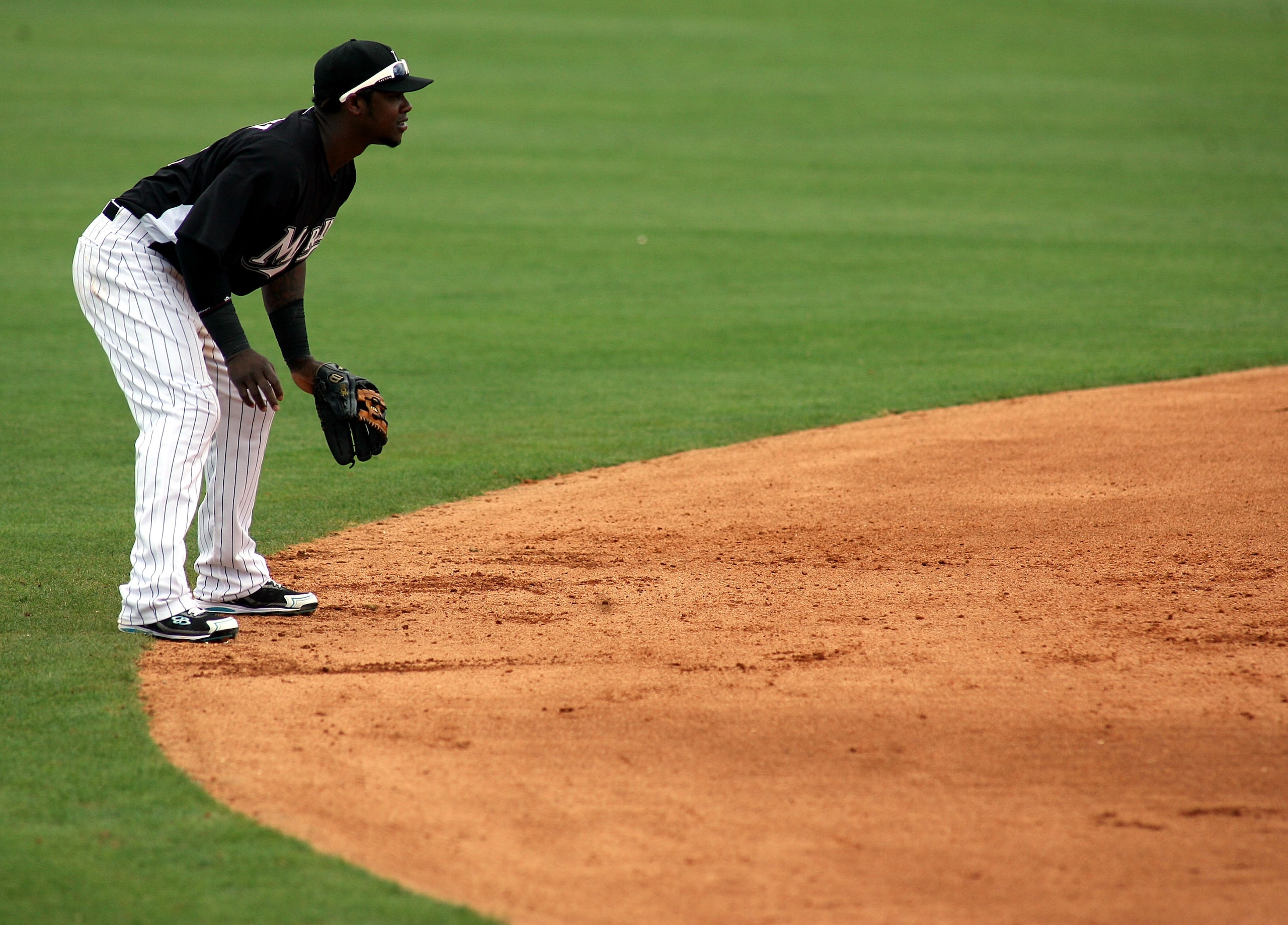 JUPITER, FL - MARCH 06:  Hanley Ramirez #2 of the Florida Marlins plays the field against the St. Louis Cardinals at Roger Dean Stadium on March 6, 2011 in Jupiter, Florida.  (Photo by Marc Serota/Getty Images)