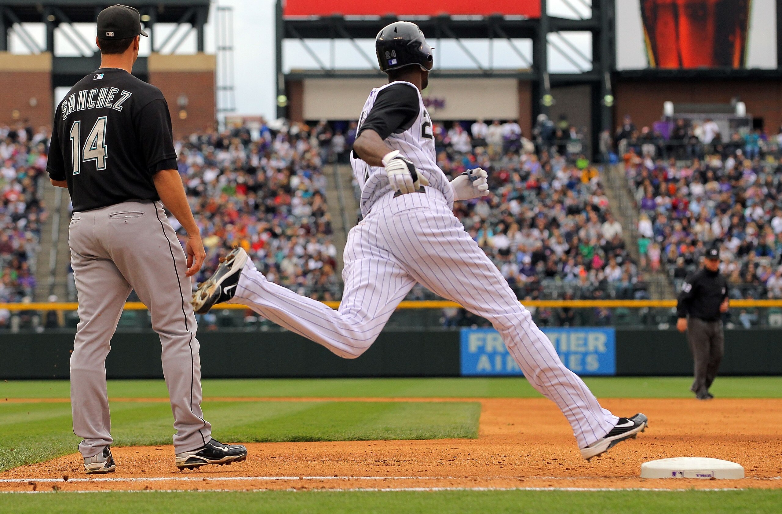 DENVER - APRIL 25:  Dexter Fowler #24 of the Colorado Rockies rounds first base against the Florida Marlins at Coors Field on April 25, 2010 in Denver, Colorado. The Rockies defeated the Marlins 8-4.  (Photo by Doug Pensinger/Getty Images)