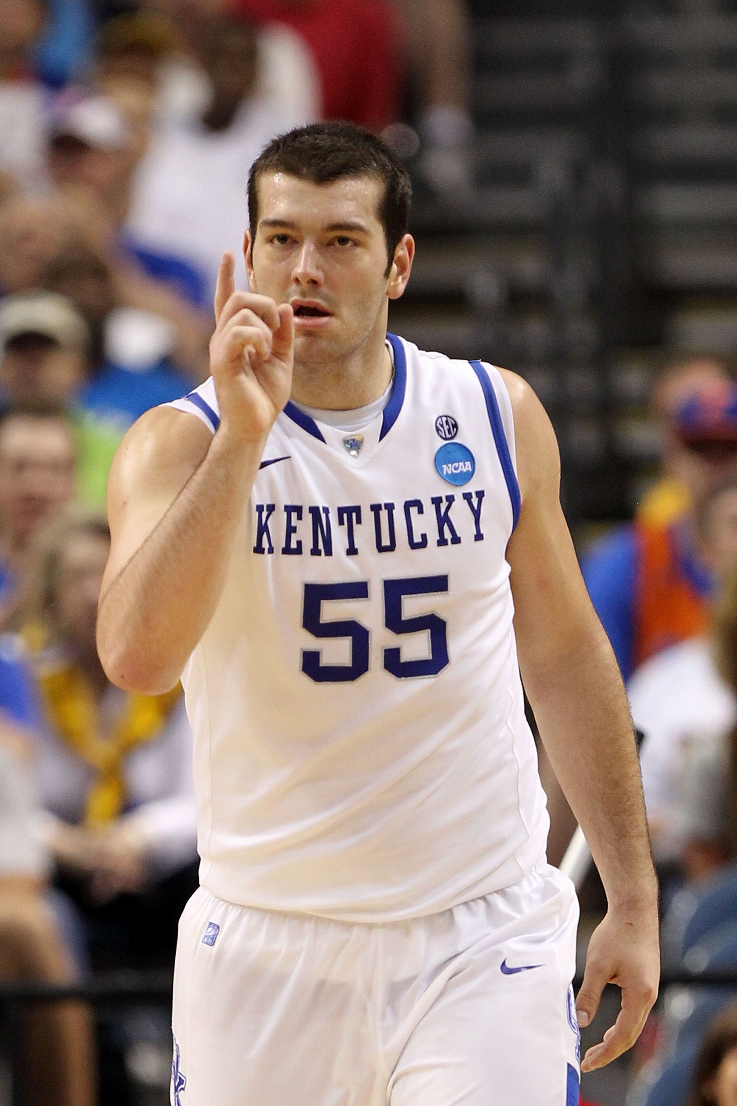 TAMPA, FL - MARCH 19:  Josh Harrellson #55 of the Kentucky Wildcats gestures as he reacts against the West Virginia Mountaineers during the third round of the 2011 NCAA men's basketball tournament at St. Pete Times Forum on March 19, 2011 in Tampa, Florid