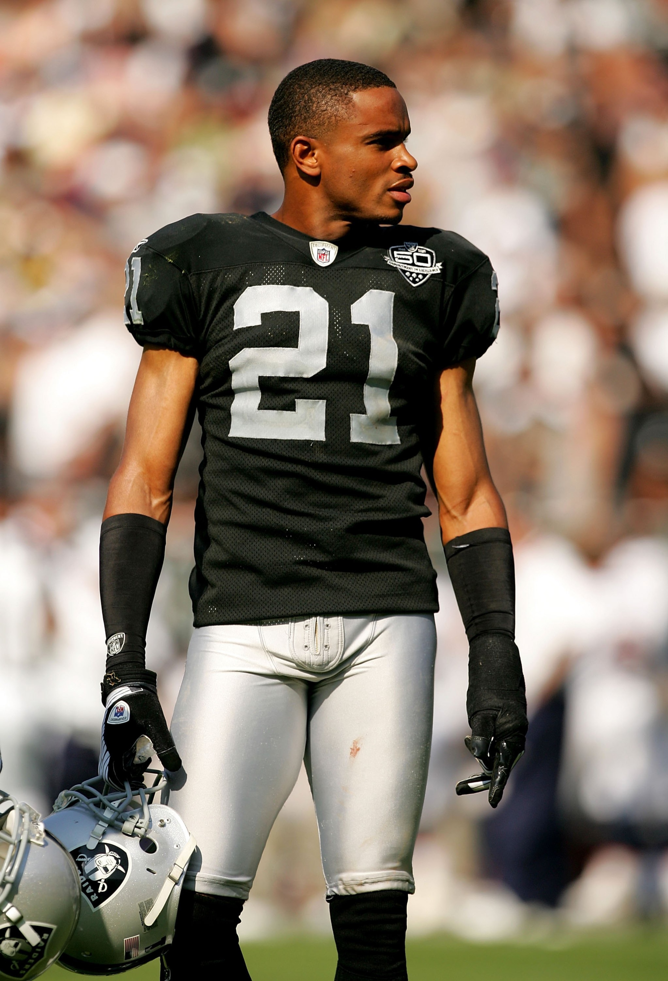 OAKLAND, CA - SEPTEMBER 27:  Nnamdi Asomugha #21 takes off his helmet during a break in play in their game against the Denver Broncos at the Oakland-Alameda County Coliseum on September 27, 2009 in Oakland, California.  (Photo by Ezra Shaw/Getty Images)