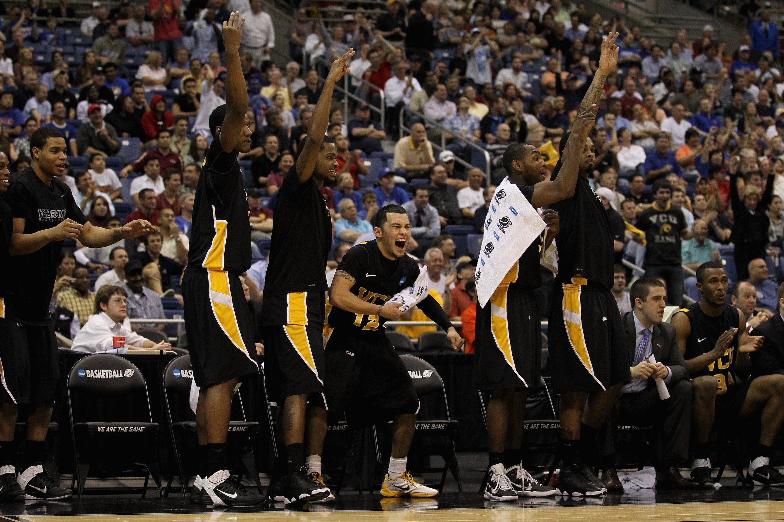 SAN ANTONIO, TX - MARCH 25:  Joey Rodriguez #12 of the Virginia Commonwealth Rams and the bench celebrate after a play against the Florida State Seminoles during the southwest regional of the 2011 NCAA men's basketball tournament at the Alamodome on March