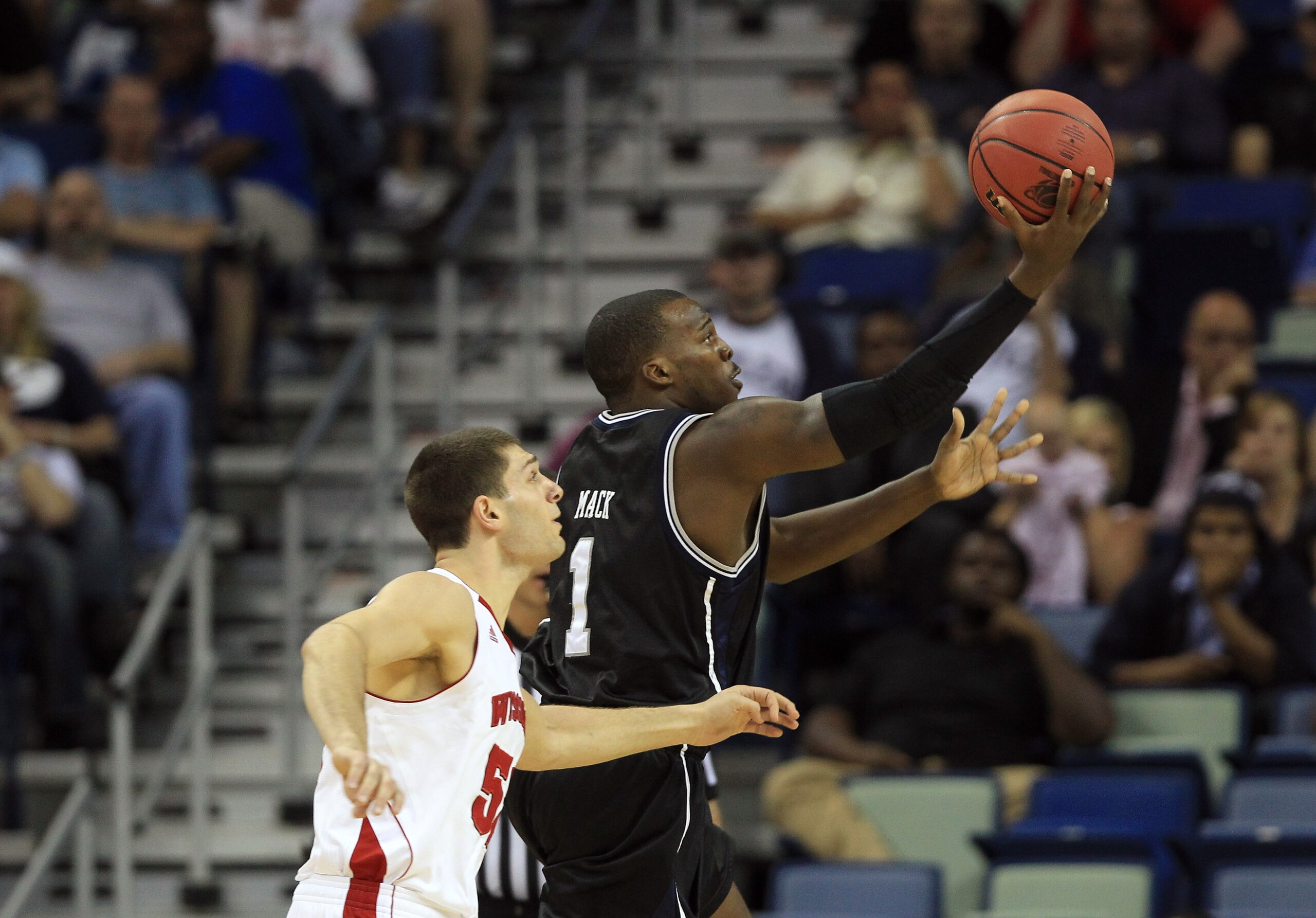 NEW ORLEANS, LA - MARCH 24:  Shelvin Mack #1 of the Butler Bulldogs shoots against Keaton Nankivil #52 of the Wisconsin Badgers during the Southeast regional of the 2011 NCAA men's basketball tournament at New Orleans Arena on March 24, 2011 in New Orlean