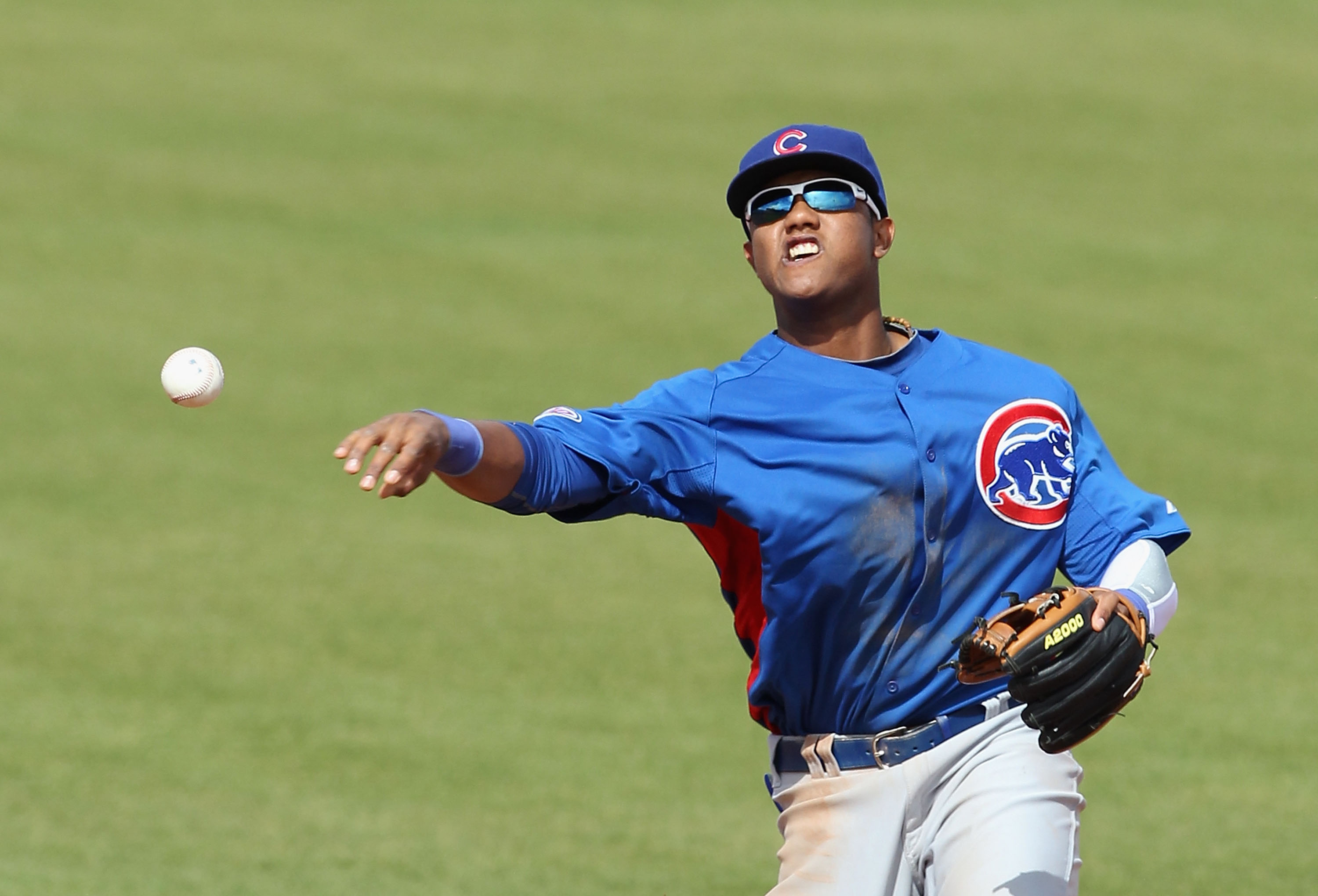 SCOTTSDALE, AZ - MARCH 01:  Infielder Starlin Castro #13 of the Chicago Cubs throws to first base attempting to turn a double play during the spring training game against the San Francisco Giants at Scottsdale Stadium on March 1, 2011 in Scottsdale, Arizo