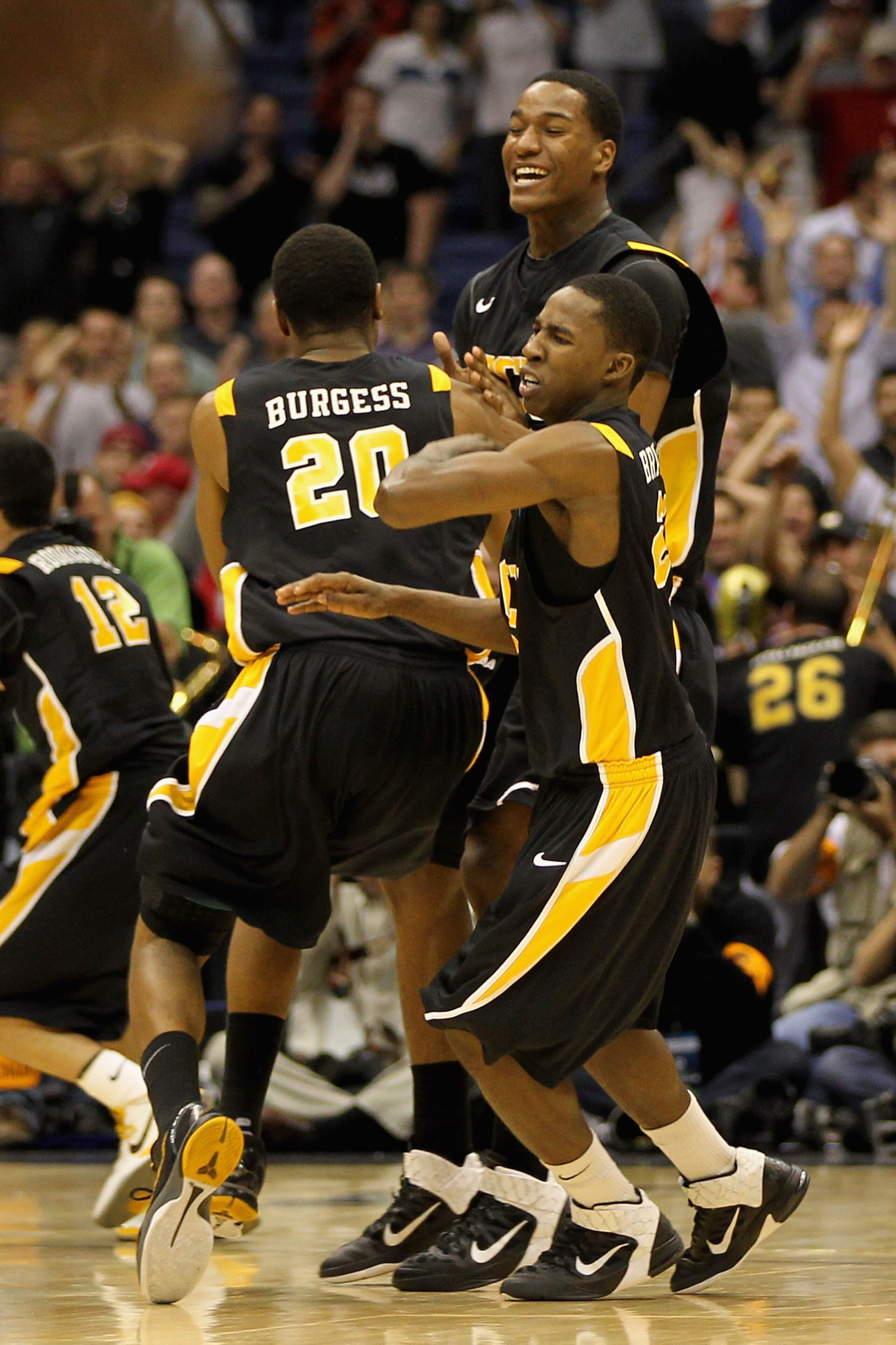 SAN ANTONIO, TX - MARCH 25:  Bradford Burgess #20 of the Virginia Commonwealth Rams celebrates after making the game winning shot against the Florida State Seminoles during the southwest regional of the 2011 NCAA men's basketball tournament at the Alamodo