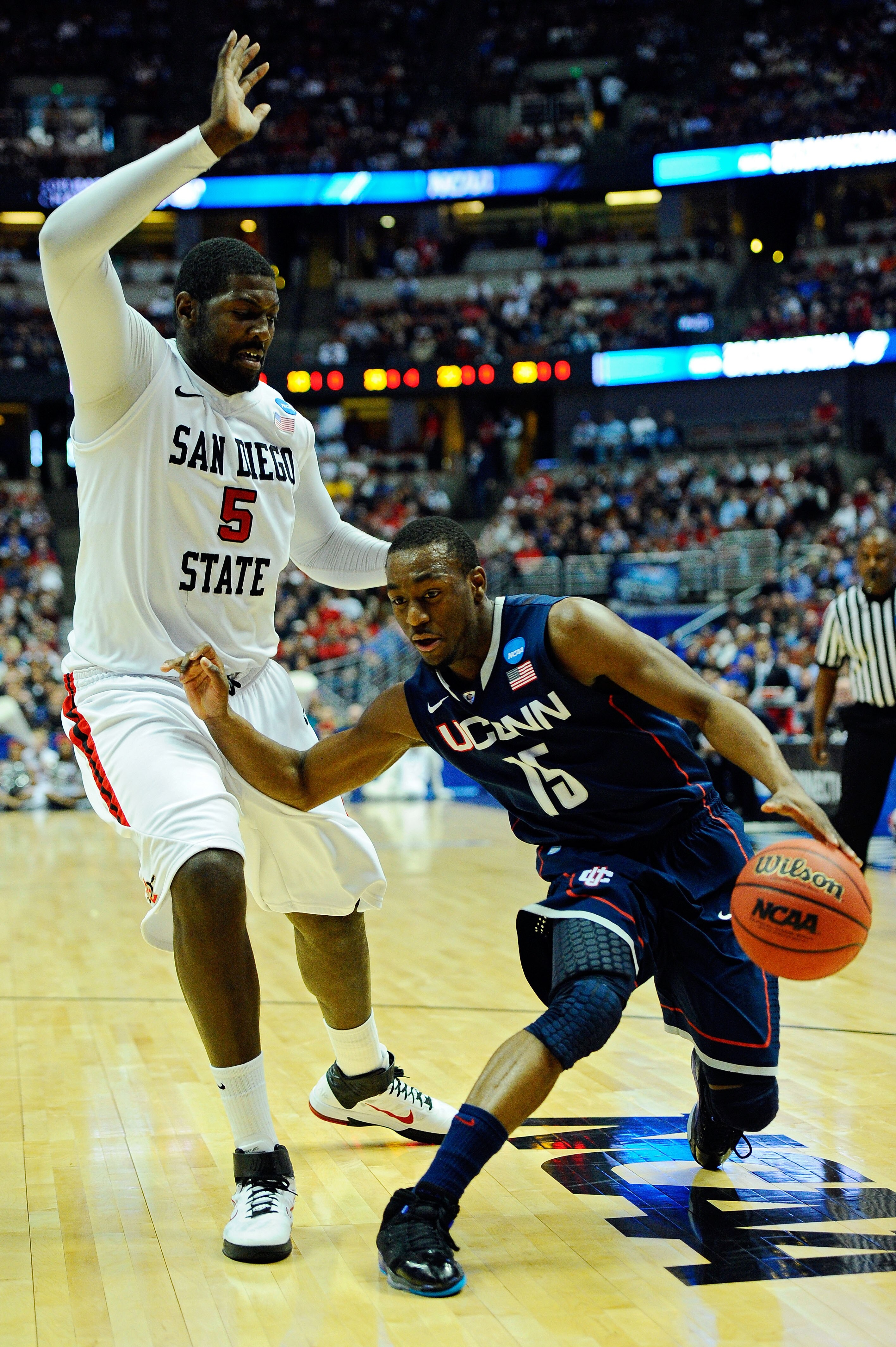ANAHEIM, CA - MARCH 24:  Kemba Walker #15 of the Connecticut Huskies handles the ball against Brian Carlwell #5 of the San Diego State Aztecs during the west regional semifinal of the 2011 NCAA men's basketball tournament at the Honda Center on March 24,