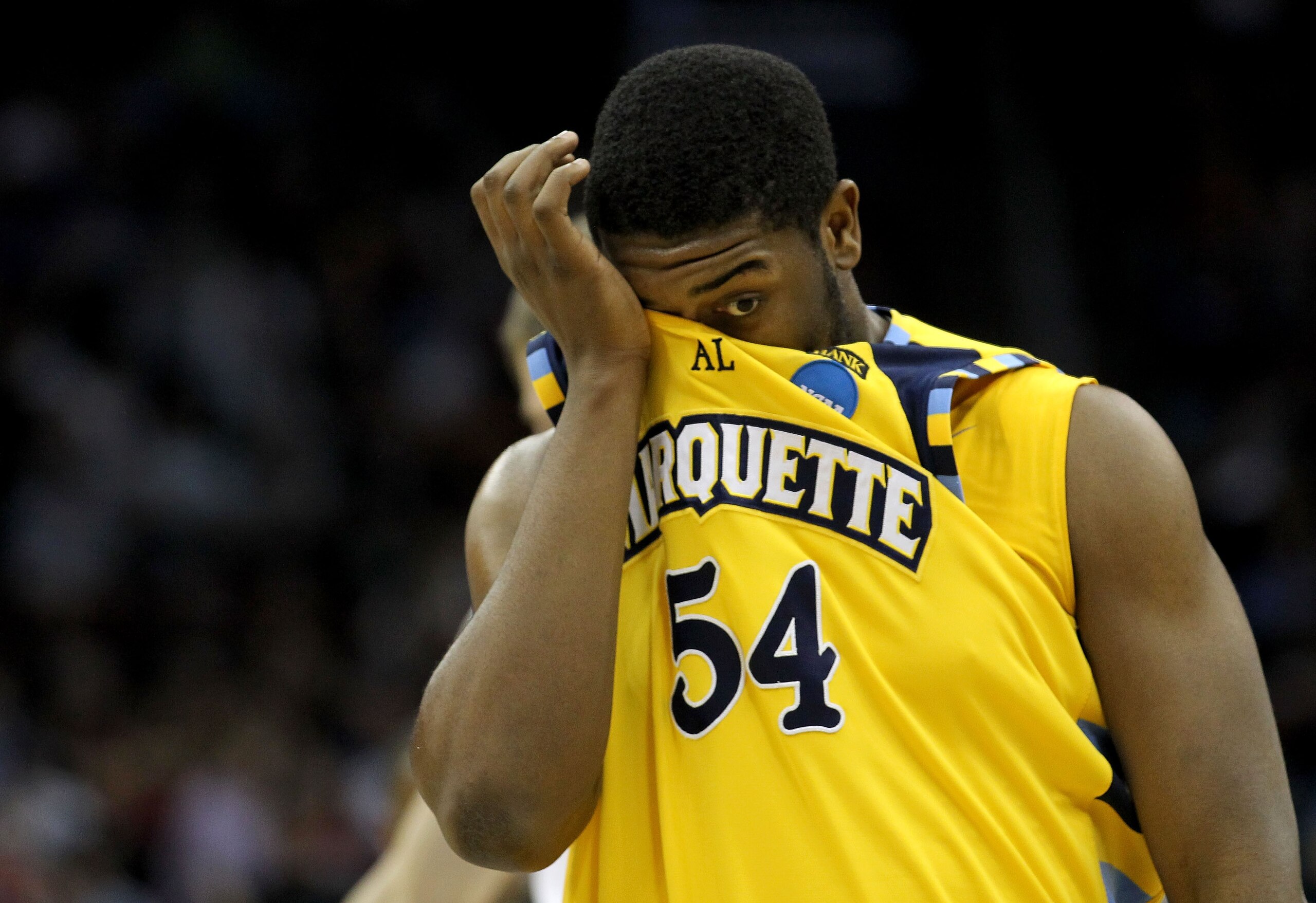 NEWARK, NJ - MARCH 25:  Davante Gardner #54 of the Marquette Golden Eagles reacts after their loss against the North Carolina Tar Heels during the east regional semifinal of the 2011 NCAA Men's Basketball Tournament at the Prudential Center on March 25, 2