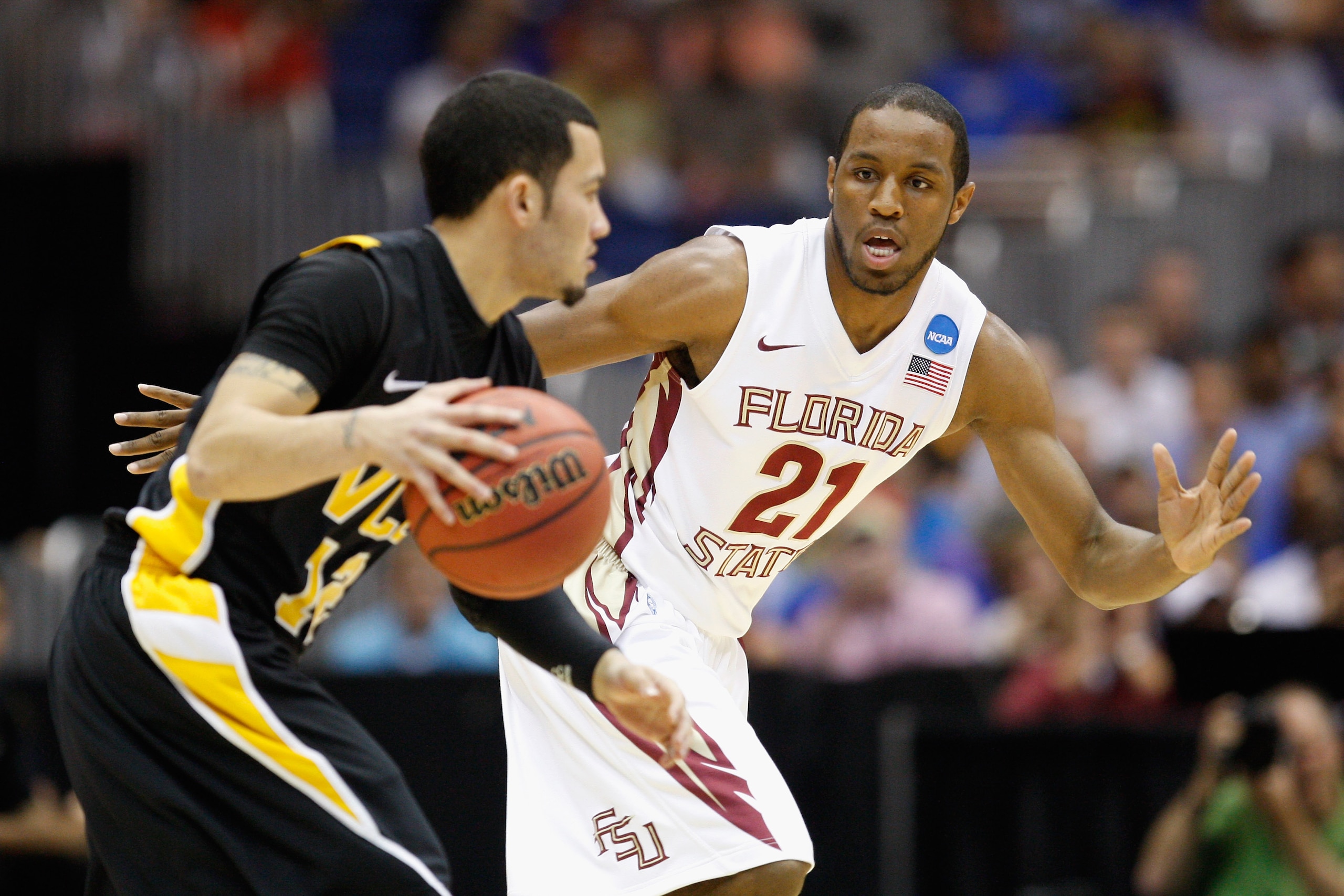 SAN ANTONIO, TX - MARCH 25:  Michael Snaer #21 of the Florida State Seminoles defends against Joey Rodriguez #12 of the Virginia Commonwealth Rams during the southwest regional of the 2011 NCAA men's basketball tournament at the Alamodome on March 25, 201
