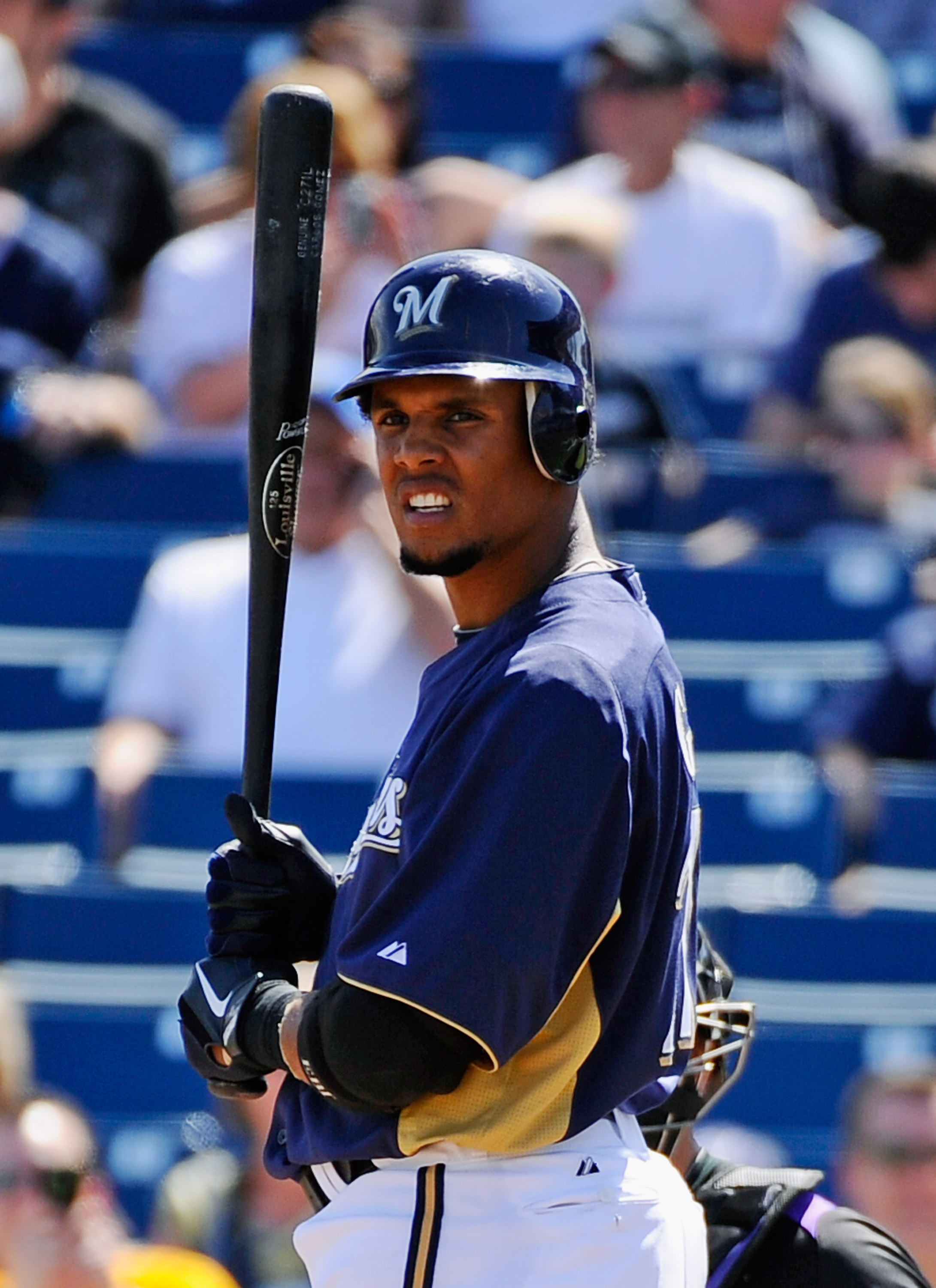 PHOENIX, AZ - MARCH 10:  Carlos Gomez #27 of the Milwaukee Brewers against the Colorado Rockies during the spring training baseball game at Maryvale Baseball Park on March 10, 2011 in Phoenix, Arizona.  (Photo by Kevork Djansezian/Getty Images)