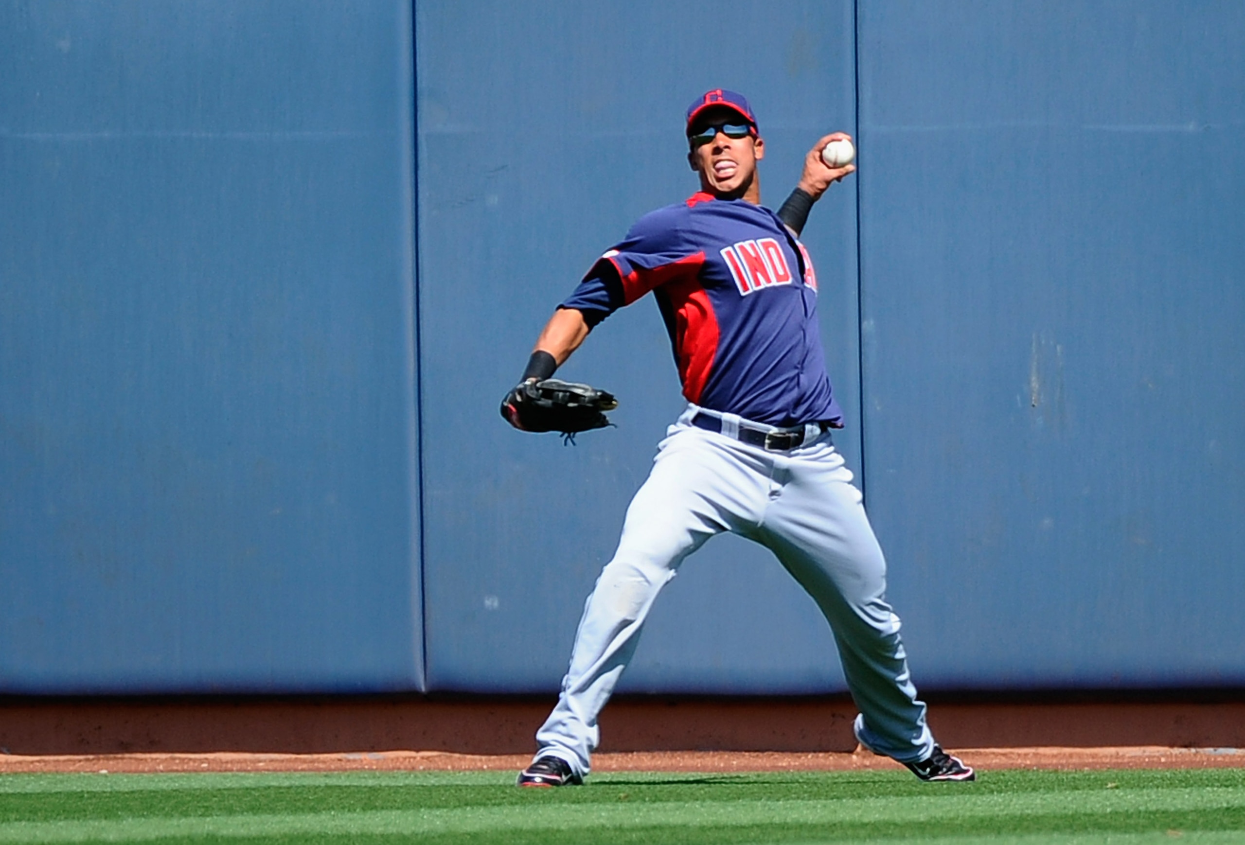 PEORIA, AZ - MARCH 13:  Michael Brantley #23 of the Cleveland Indians throws from center field after a double by Eric Patterson #9 of the San Diego Padres during the first inning of the spring training baseball game at Peoria Stadium on March 13, 2011 in 