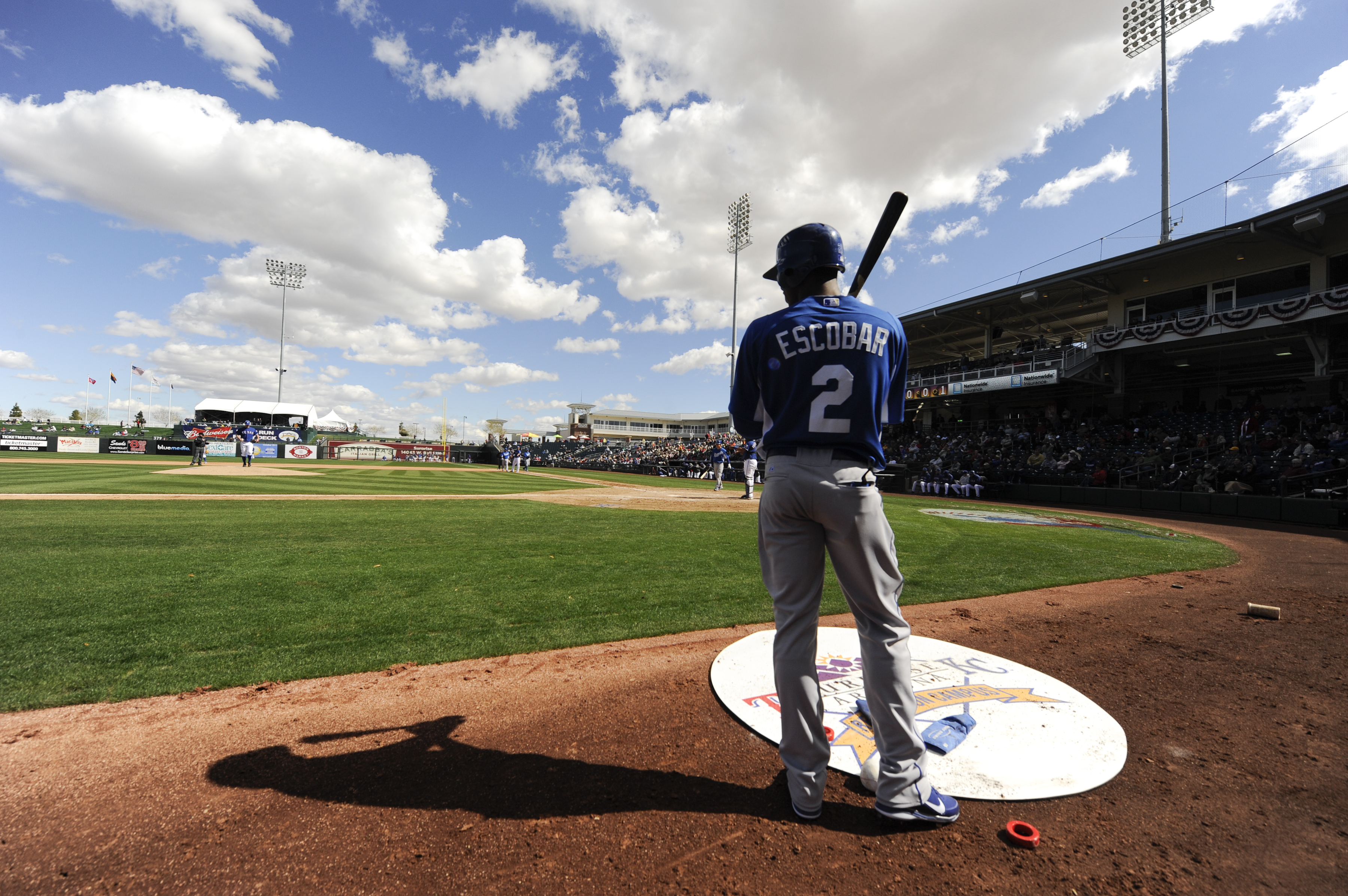 SURPISE, AZ - FEBRUARY 27: Alcides Escobar #2 of the Kansas City Royals looks on from the on deck circle during a spring training game against the Texas Rangers at Surprise Stadium on February 27, 2011 in Surprise, Arizona. (Photo by Rob Tringali/Getty Im