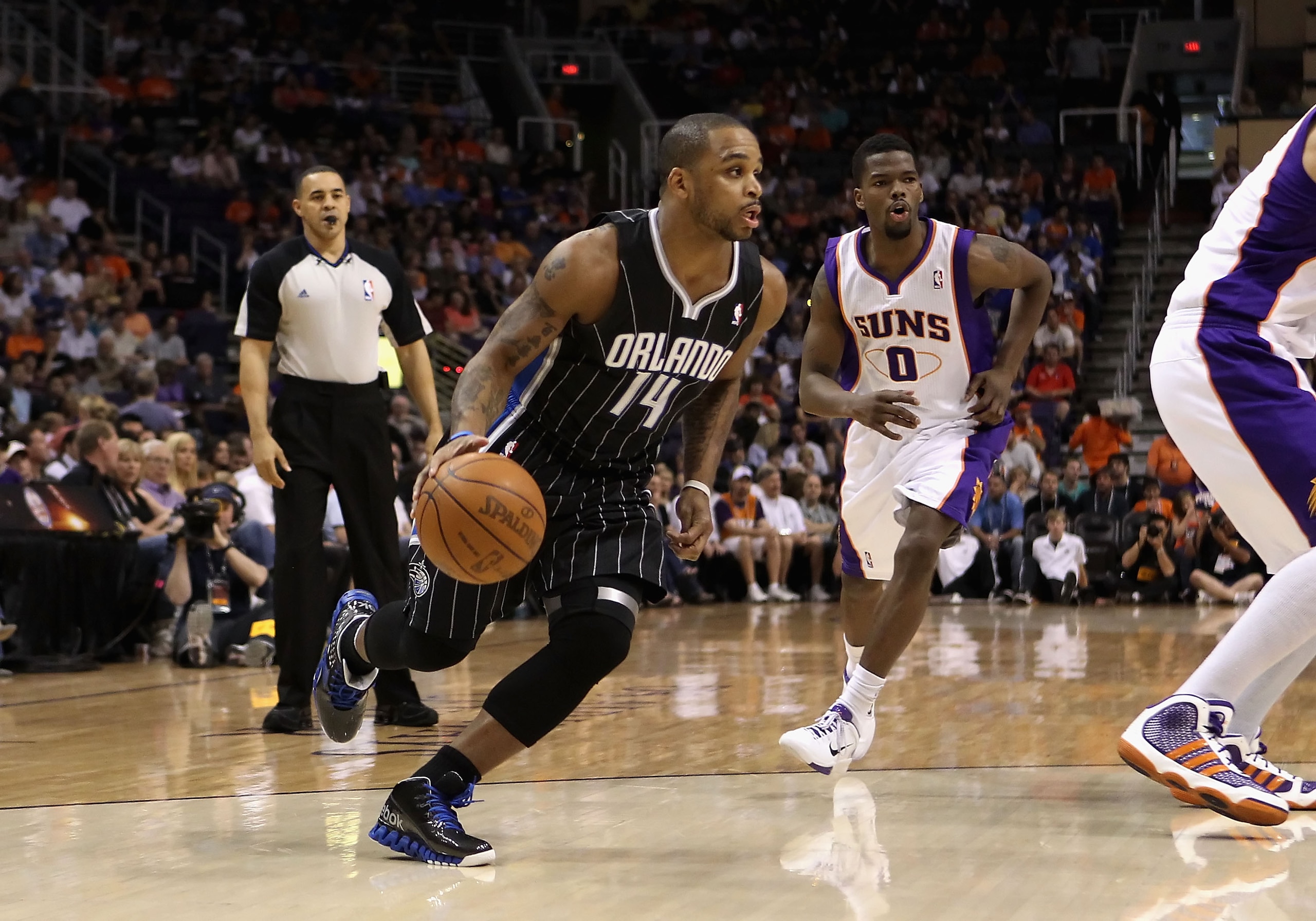 PHOENIX, AZ - MARCH 13:  Jameer Nelson #14 of the Orlando Magic handles the ball during the NBA game against the Phoenix Suns at US Airways Center on March 13, 2011 in Phoenix, Arizona. The Magic defeated the Suns 111-88. NOTE TO USER: User expressly ackn