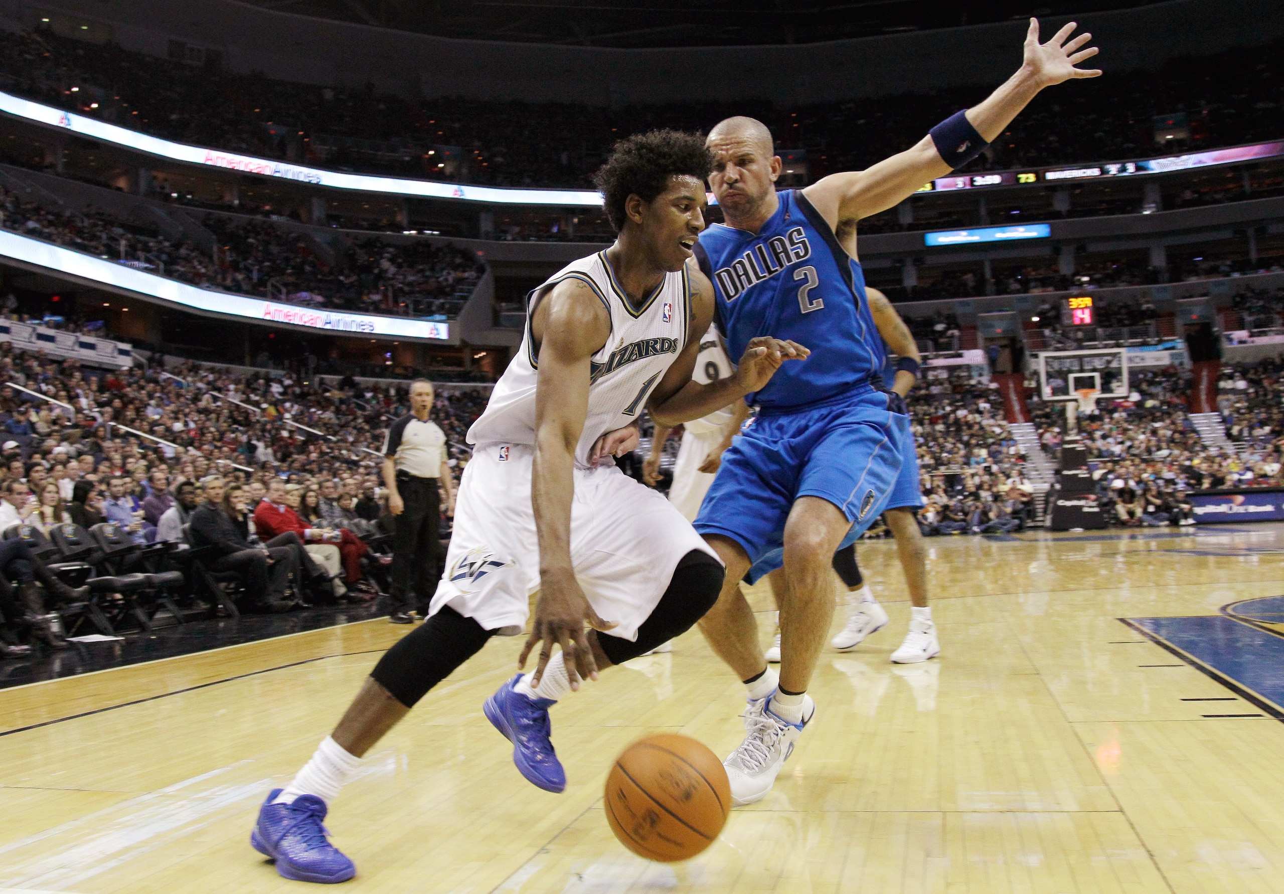 WASHINGTON, DC - FEBRUARY 26: Nick Young #1 of the Washington Wizards drives around Jason Kidd #2 of the Dallas Mavericks at the Verizon Center on February 26, 2011 in Washington, DC. NOTE TO USER: User expressly acknowledges and agrees that, by downloadi