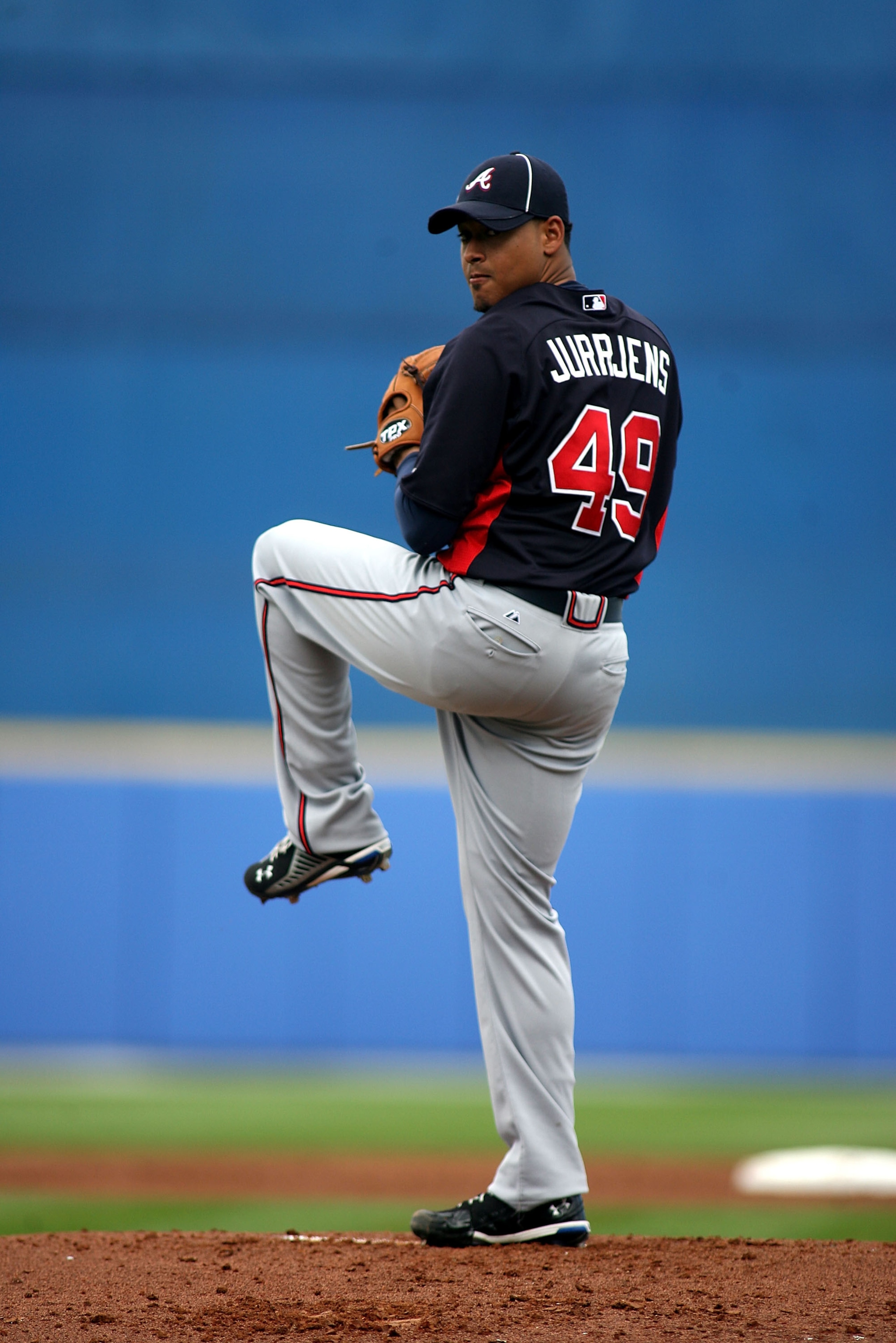 PORT ST. LUCIE, FL - FEBRUARY 26:  Pitcher Jair Jurrjens #49 of the Atlanta Braves throws against the New York Mets at Digital Domain Park on February 26, 2011 in Port St. Lucie, Florida.  (Photo by Marc Serota/Getty Images)