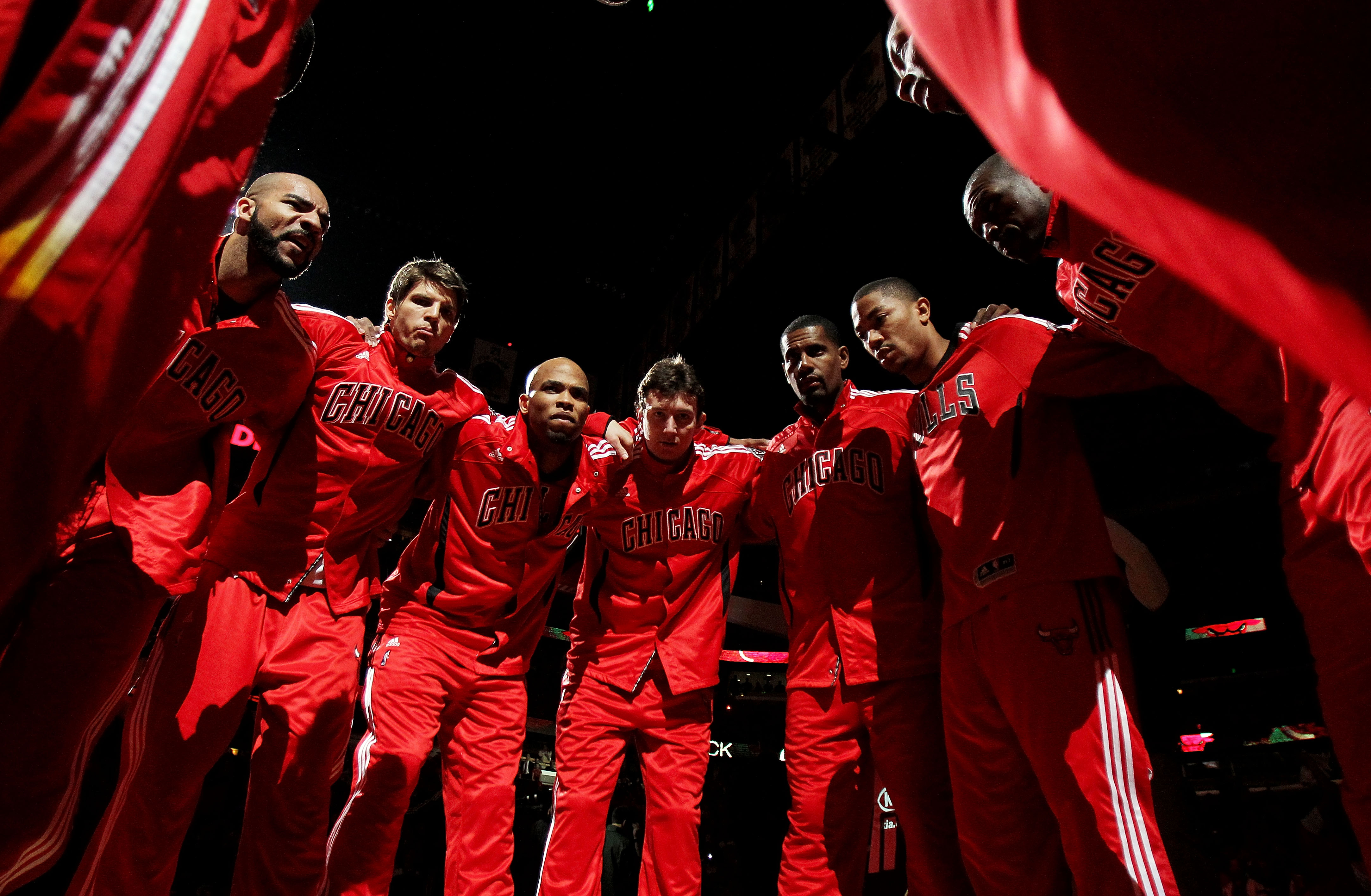 CHICAGO, IL - MARCH 25: Members of the Chicago Bulls including (L-R) Carlos Boozer #5, Kyle Korver #26, Taj Gibson #22, Omer Asik #3, Kurt Thomas #40, Derrick Rose #1, Loul Deng #9 and Keith Bogans #6 huddle before a game against the Memphis Grizzlies at