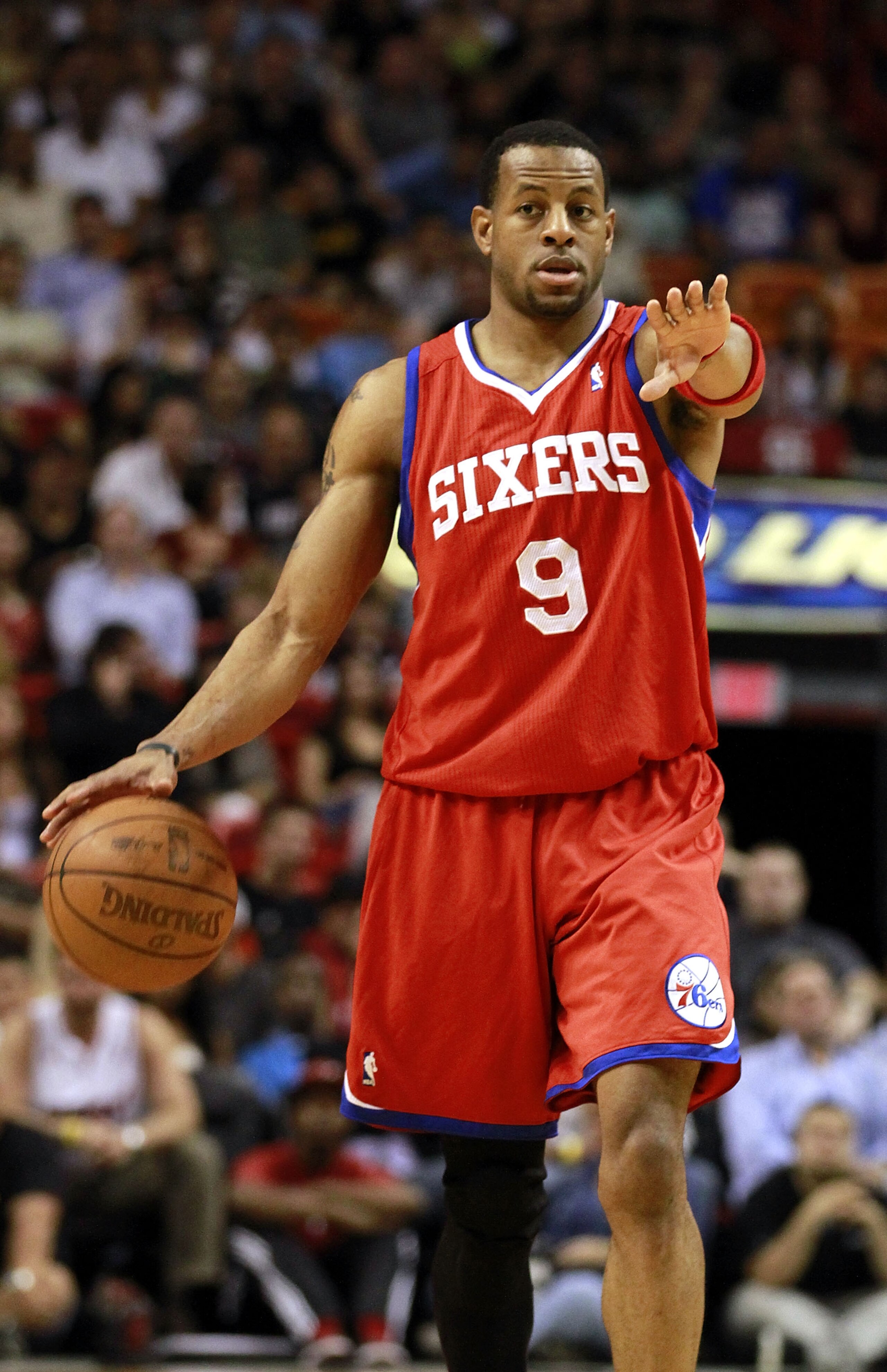 MIAMI, FL - MARCH 25: Guard Andr Iguodala #9 of the Philadelphia Sixers brings up the ball against the Miami Heat at American Airlines Arena on March 25, 2011 in Miami, Florida. The Heat defeated the Sixers 111-99. NOTE TO USER: User expressly acknowledg MIAMI, FL - MARCH 25: Guard Andr Iguodala #9 of the Philadelphia Sixers brings up the ball against the Miami Heat at American Airlines Arena on March 25, 2011 in Miami, Florida. The Heat defeated the Sixers 111-99. NOTE TO USER: User expressly acknowledg