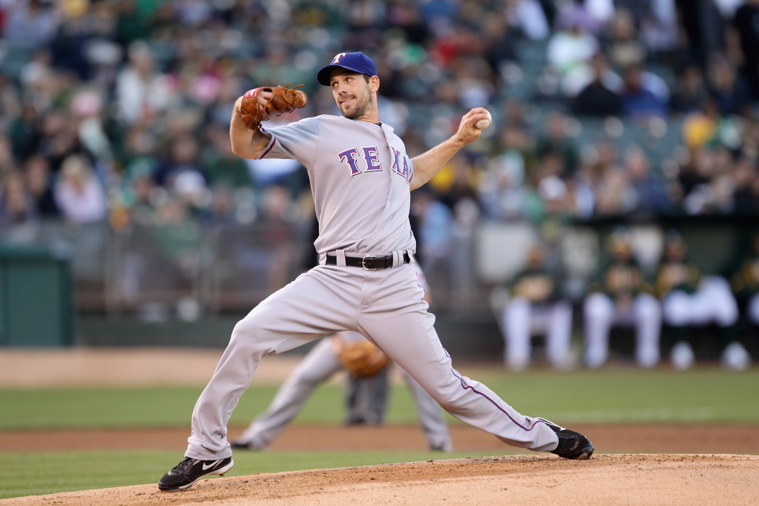 OAKLAND, CA - AUGUST 06:  Cliff Lee #33 of the Texas Rangers pitches against the Oakland Athletics at the Oakland-Alameda County Coliseum on August 6, 2010 in Oakland, California.  (Photo by Ezra Shaw/Getty Images)