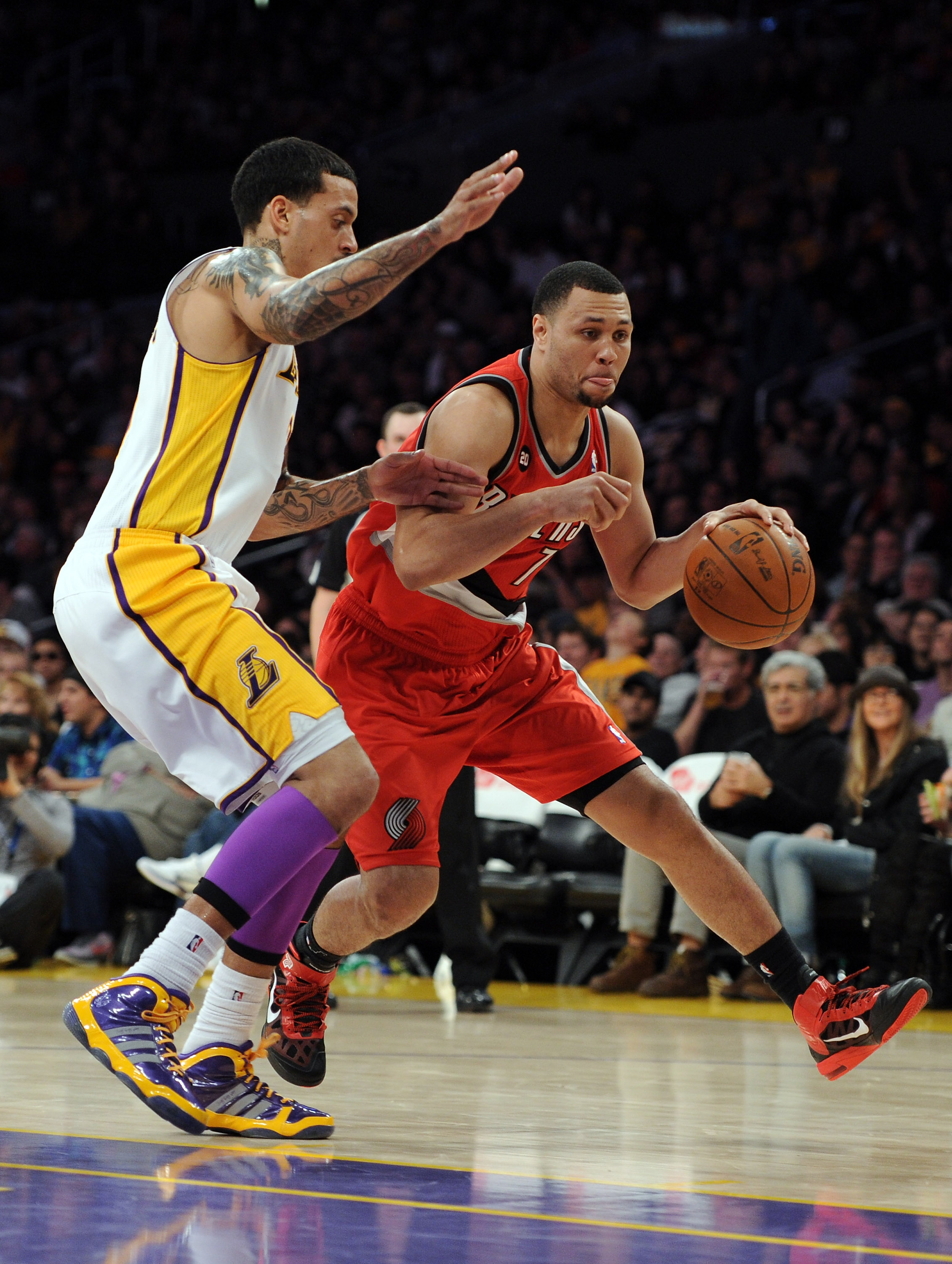 LOS ANGELES, CA - MARCH 20: Brandon Roy #7 of the Portland Trail Blazers dribbles as he is defended by Matt Barnes #9 of the Los Angeles Lakers at the Staples Center on March 20, 2011 in Los Angeles, California. NOTE TO USER: User expressly acknowledges
