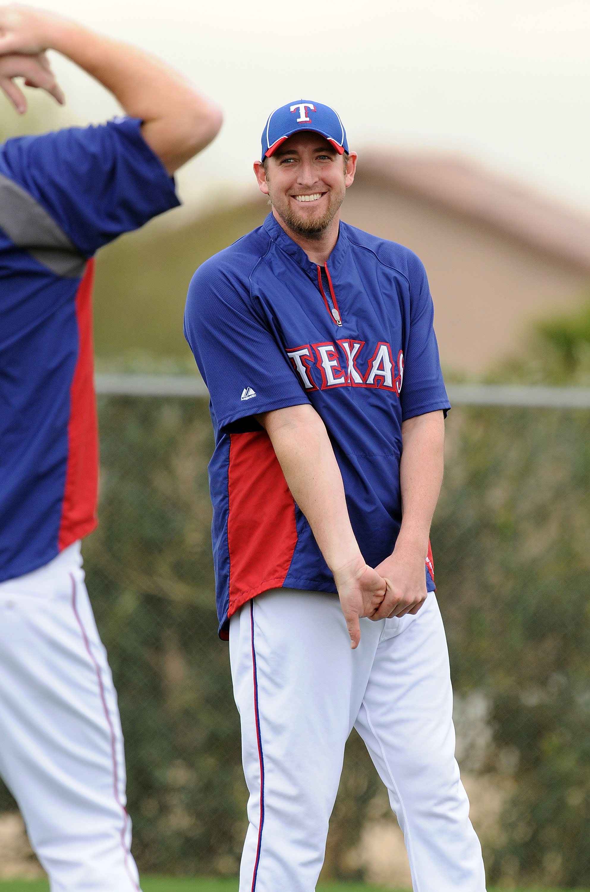 SURPRISE, AZ - FEBRUARY 18:  Brandon Webb #33 of the Texas Rangers stretches prior to spring work outs at Surprise Stadium on February 18, 2011 in Surprise, Arizona.  (Photo by Norm Hall/Getty Images)