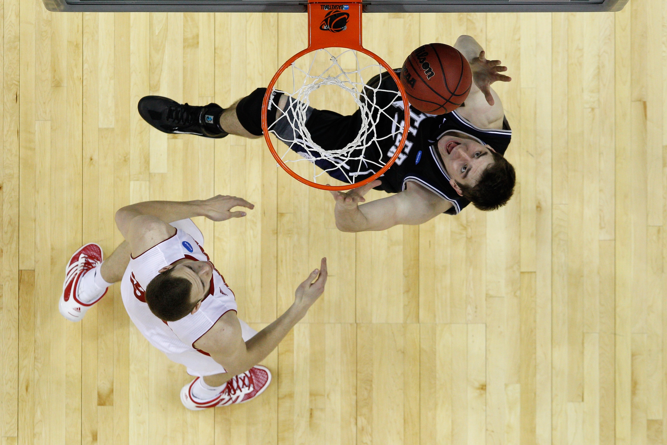 NEW ORLEANS, LA - MARCH 24:  Andrew Smith #44 of the Butler Bulldogs goes up against Keaton Nankivil #52 of the Wisconsin Badgers during the Southeast regional of the 2011 NCAA men's basketball tournament at New Orleans Arena on March 24, 2011 in New Orle
