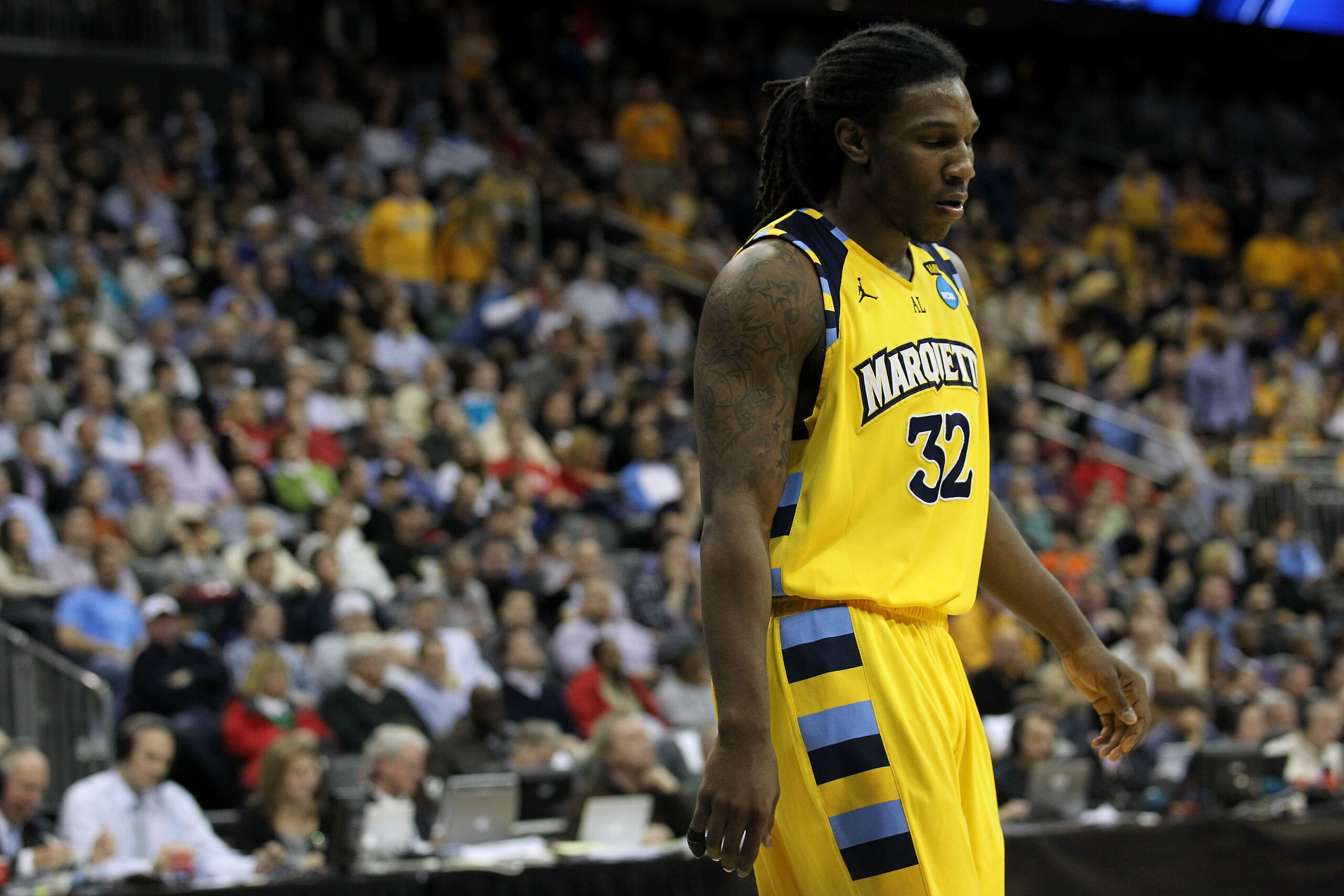 NEWARK, NJ - MARCH 25:  Jae Crowder #32 of the Marquette Golden Eagles reacts after a play against the North Carolina Tar Heels during the east regional semifinal of the 2011 NCAA Men's Basketball Tournament at the Prudential Center on March 25, 2011 in N