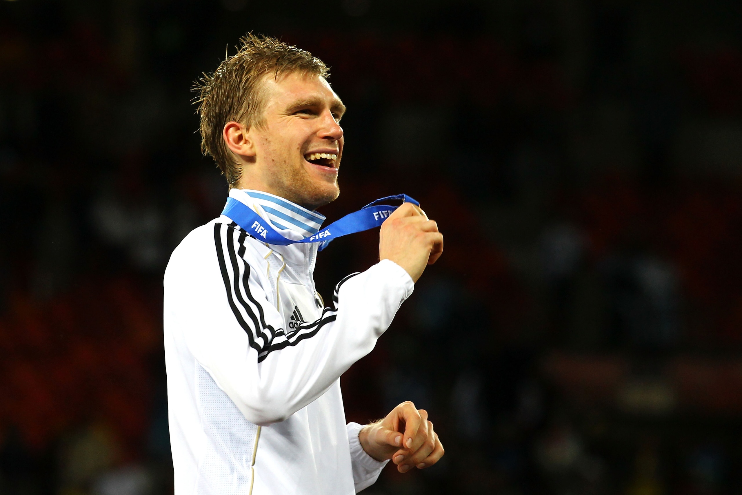 PORT ELIZABETH, SOUTH AFRICA - JULY 10:  Per Mertesacker of Germany celebrates victory and third place following the 2010 FIFA World Cup South Africa Third Place Play-off match between Uruguay and Germany at The Nelson Mandela Bay Stadium on July 10, 2010